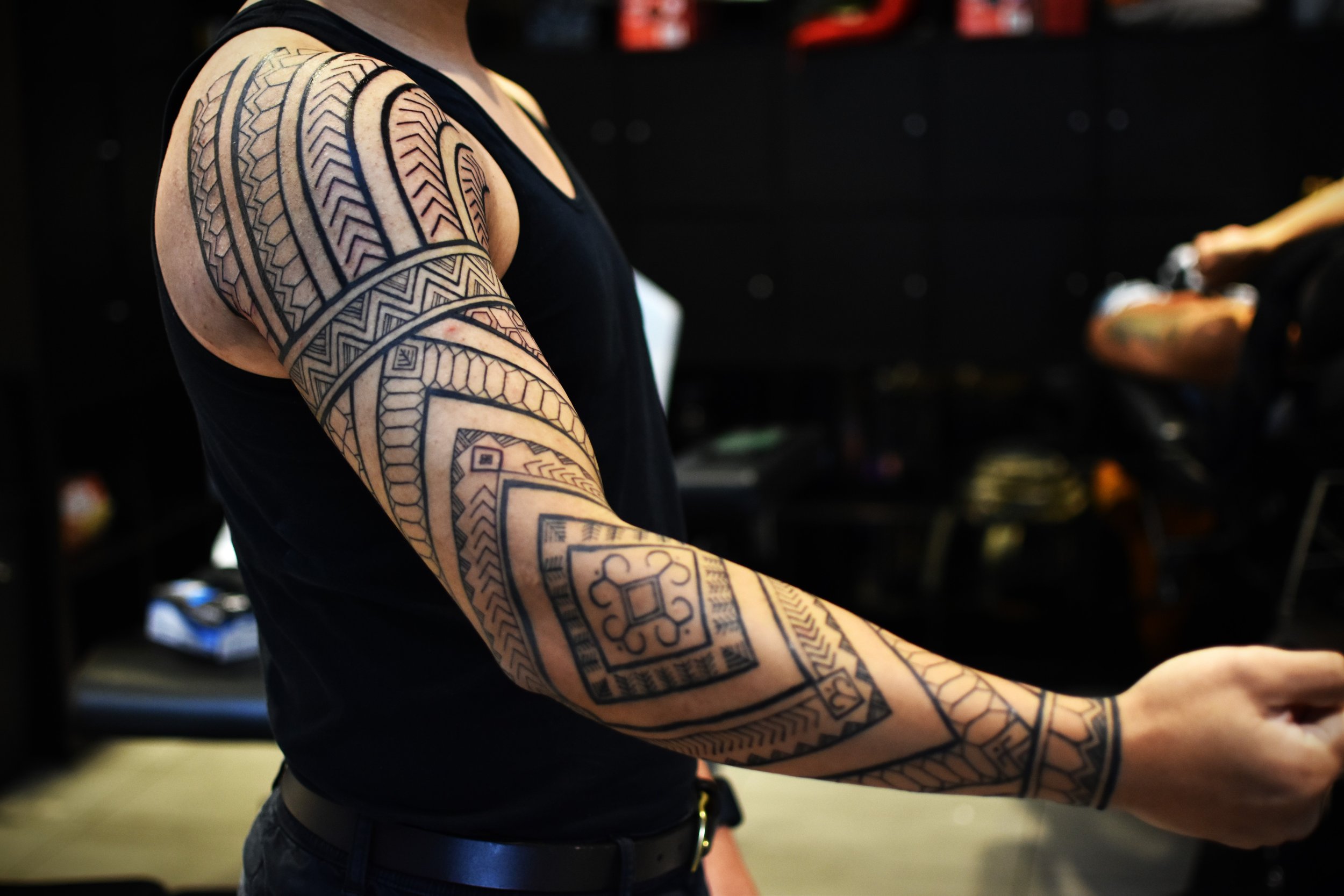 tribal tattoo sleeve by Eugene Perez