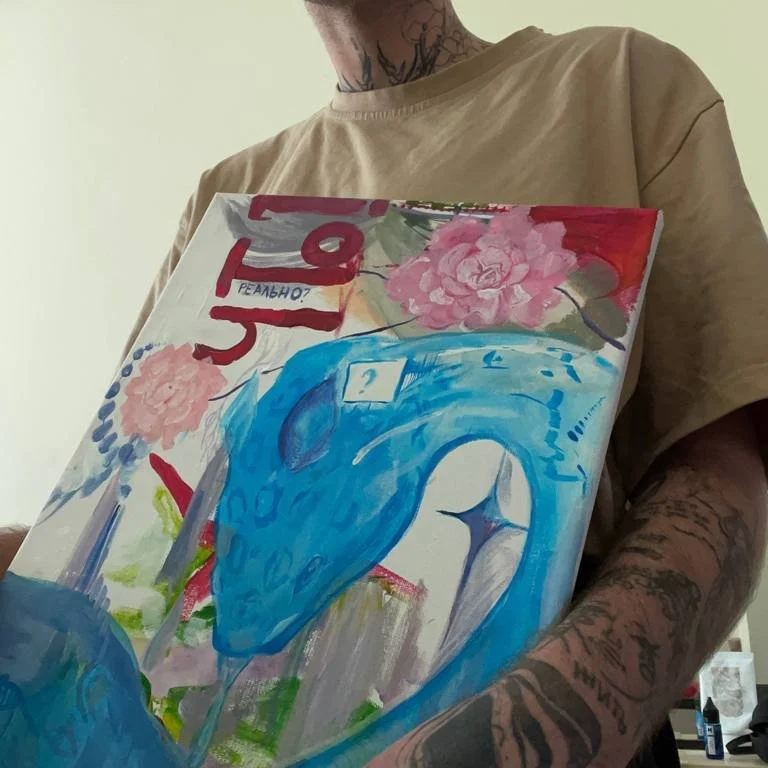 Art by Ilya Black - IIya holding abstract painting