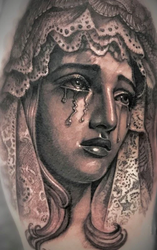 black and gray tattoo by Vic Tamian