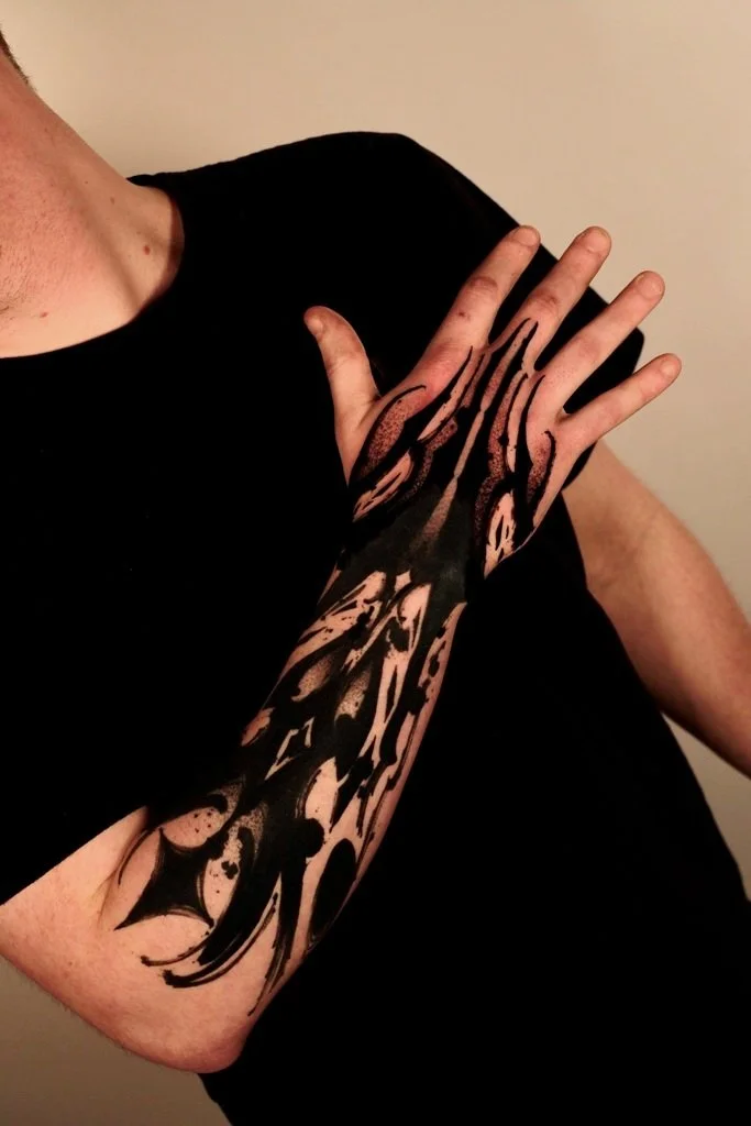 black and gray arm tattoo by Misha Bardak artist