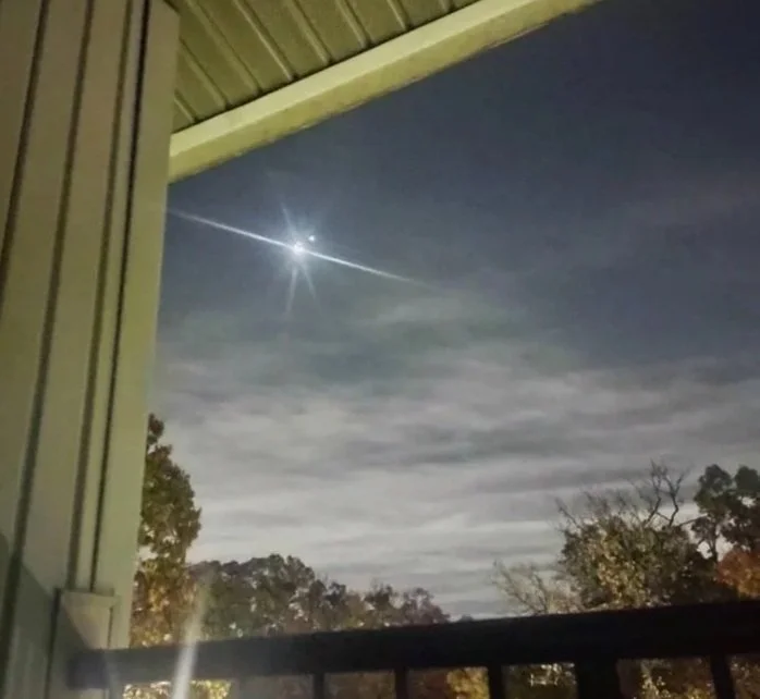 night sky - moon with light visible next to it