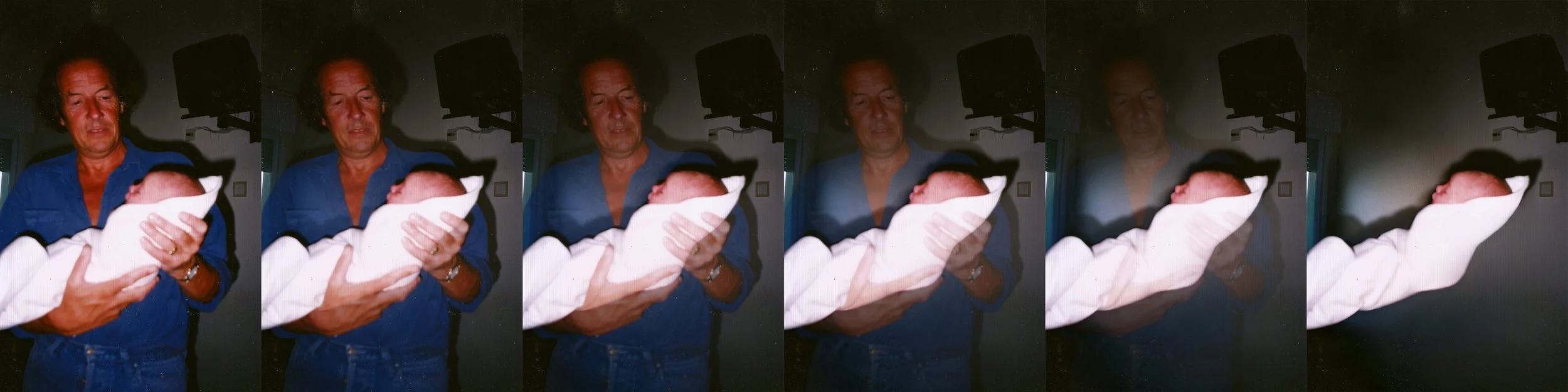 photo by William Josephs Radford - father holding baby