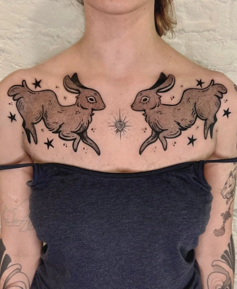 Laura_Arroz_tattoo_artist-chest tattoo of rabbits and stars