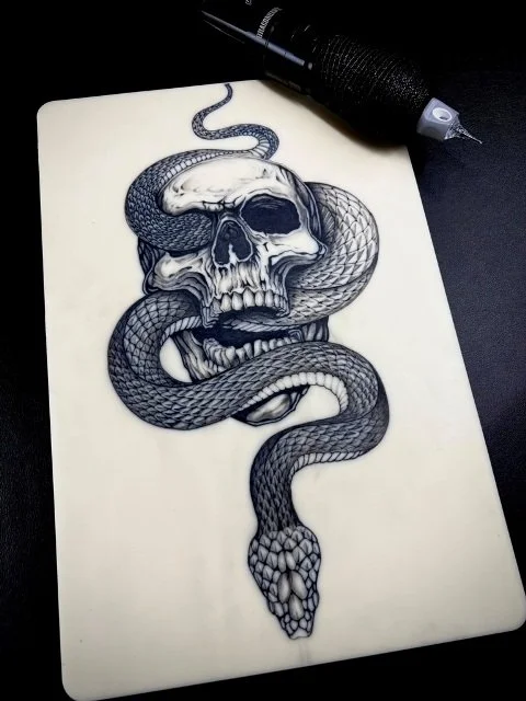bone_merchant tattoo artist - skull with snake