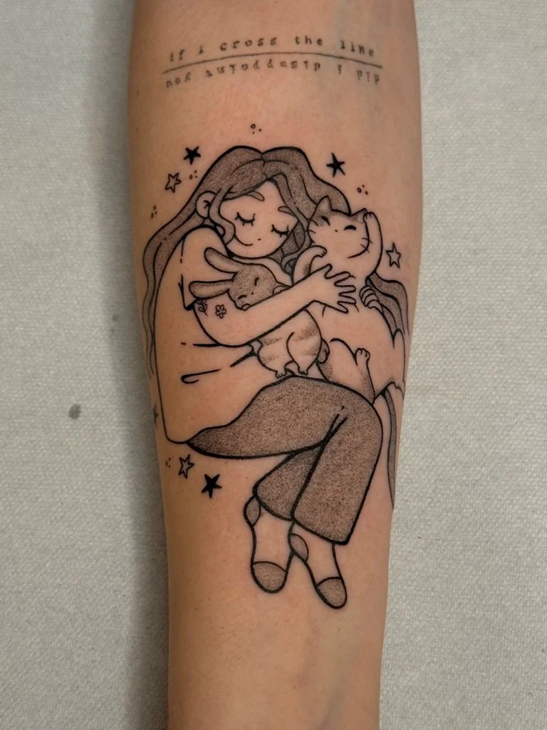 Laura_Arroz_tattoo_artist-woman holding cat and bunny cute tattoo on arm