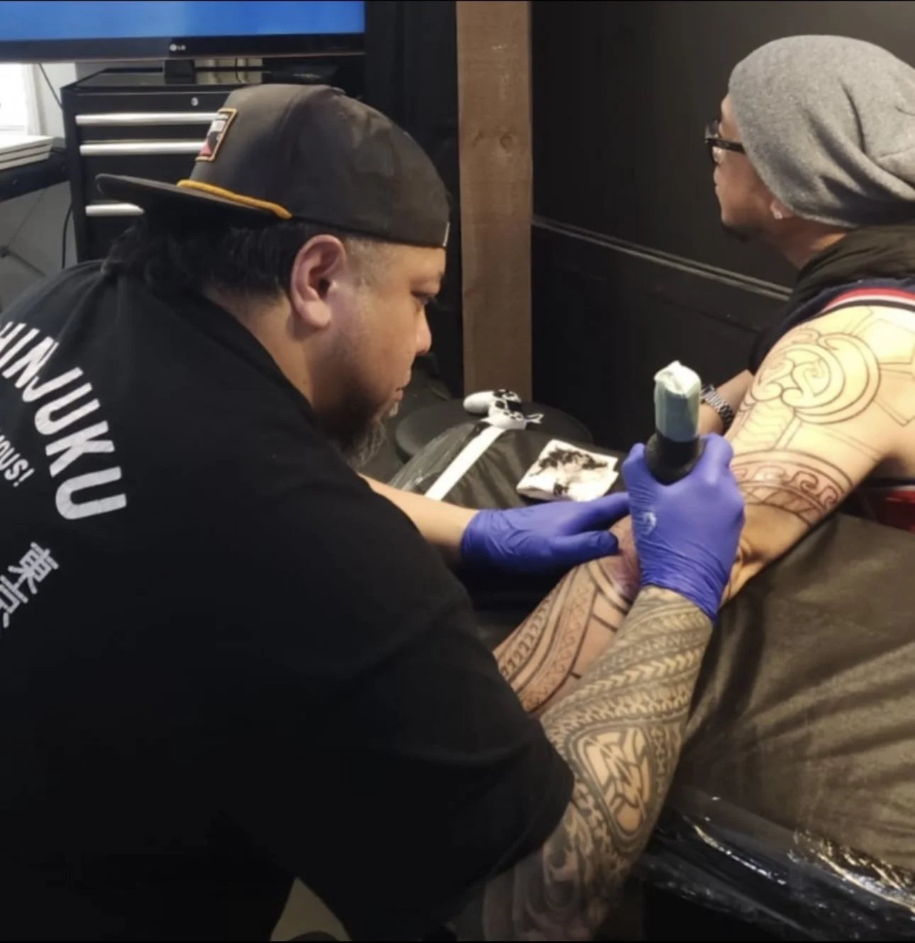 Eugene Perez - tattoo artist at work