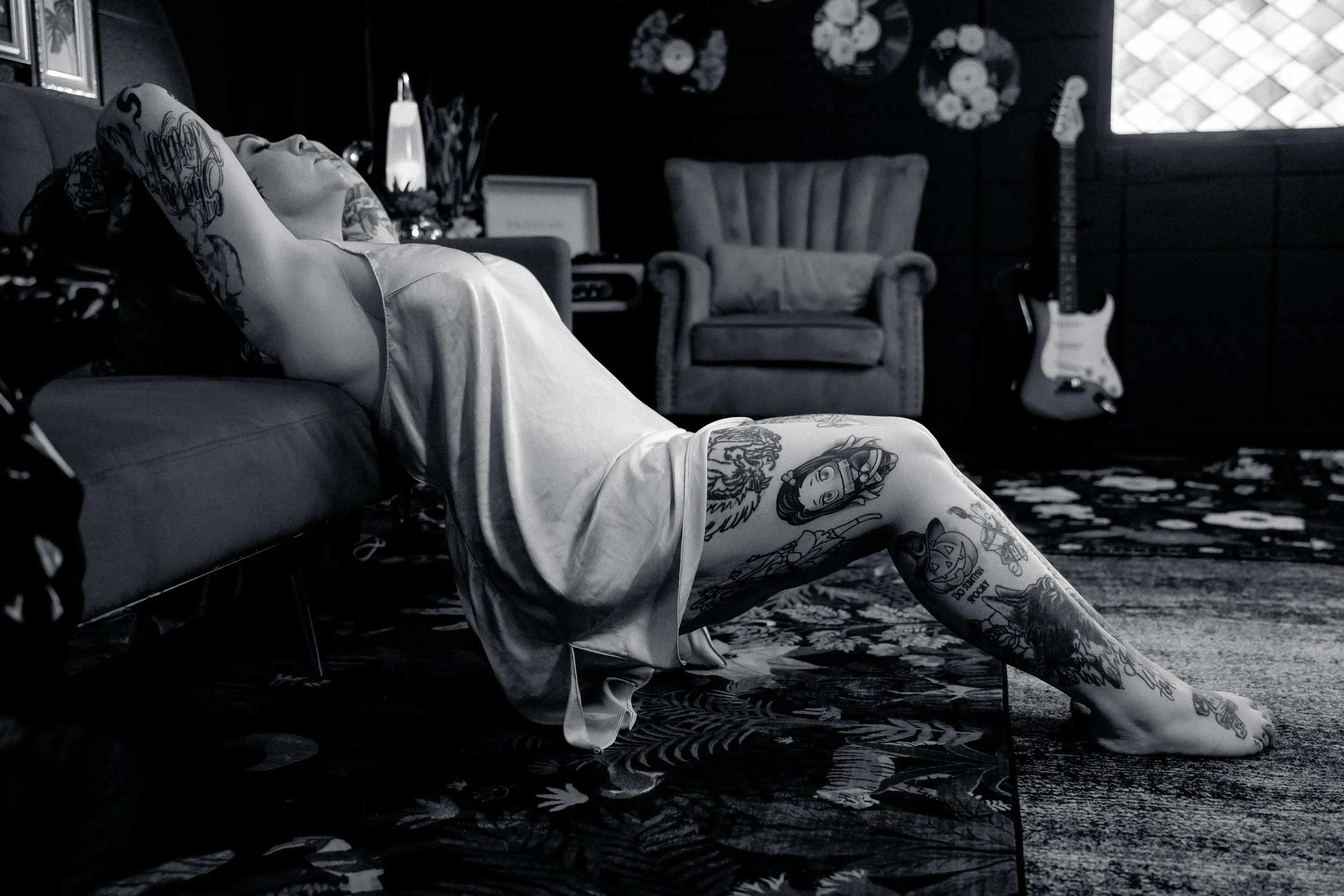 Empowerment and sensual boudoir studio in Greenville, South Carolina featuring a confident woman in a softly lit, moody setting