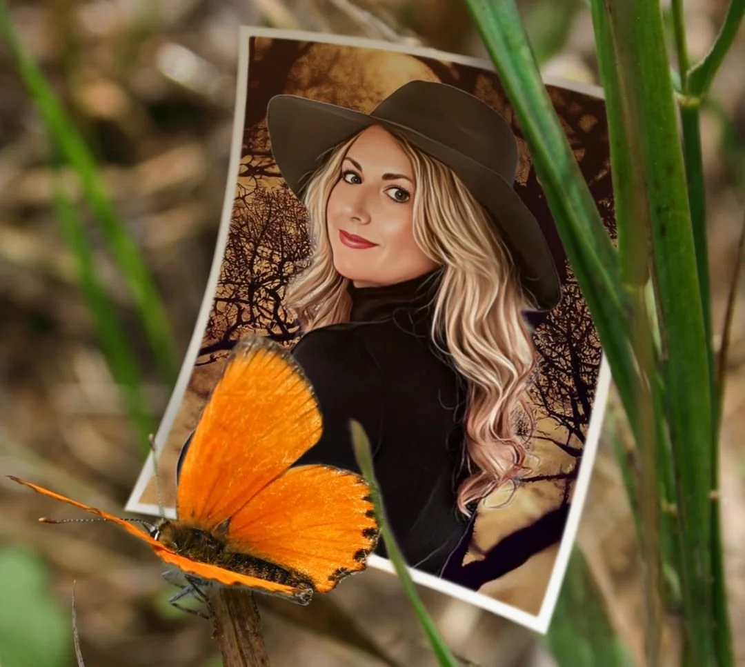 A photograph of a woman with long blonde hair, wearing a black hat and black top, is displayed amidst green grass. A large orange butterfly is perched on a twig in front of her photo. The background of the photo features a silhouette of trees and an outdoor scene.