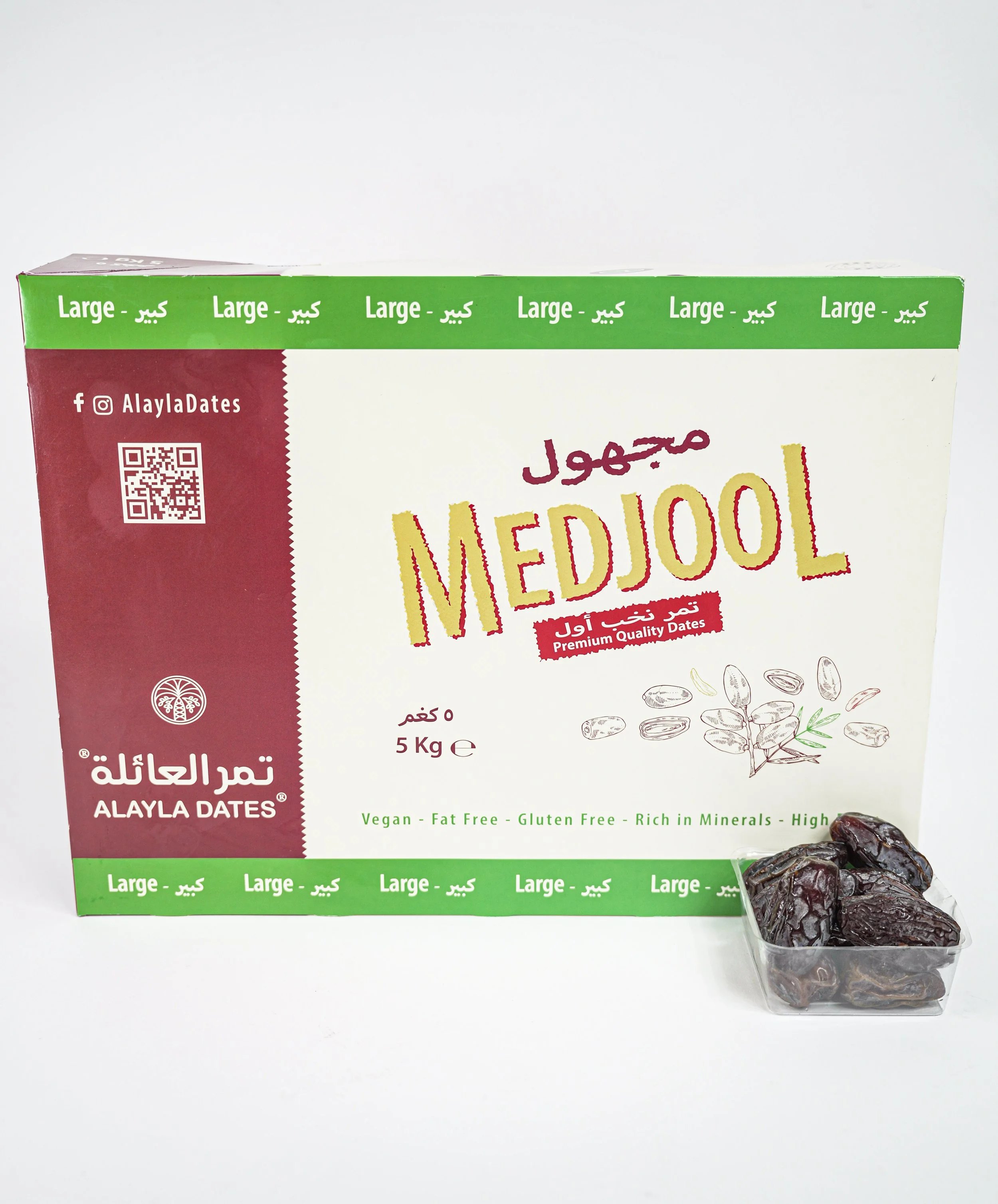 A box of premium Medjool dates with a small container of dates in front of it, featuring green and red design elements, Arabic and English text, and a QR code.