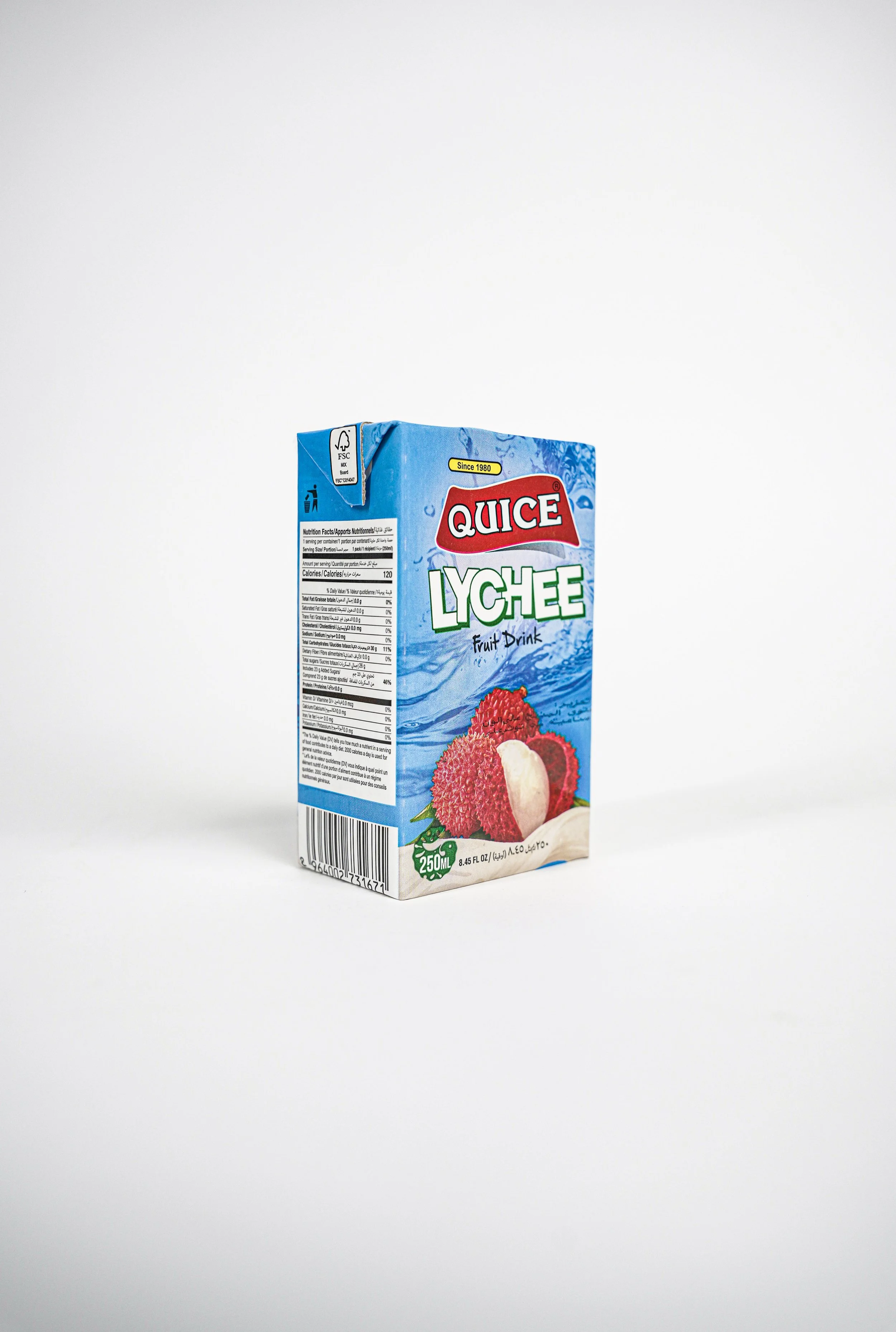 Quice Lychee fruit drink with images of lychee fruits on the front. Available in Qatar