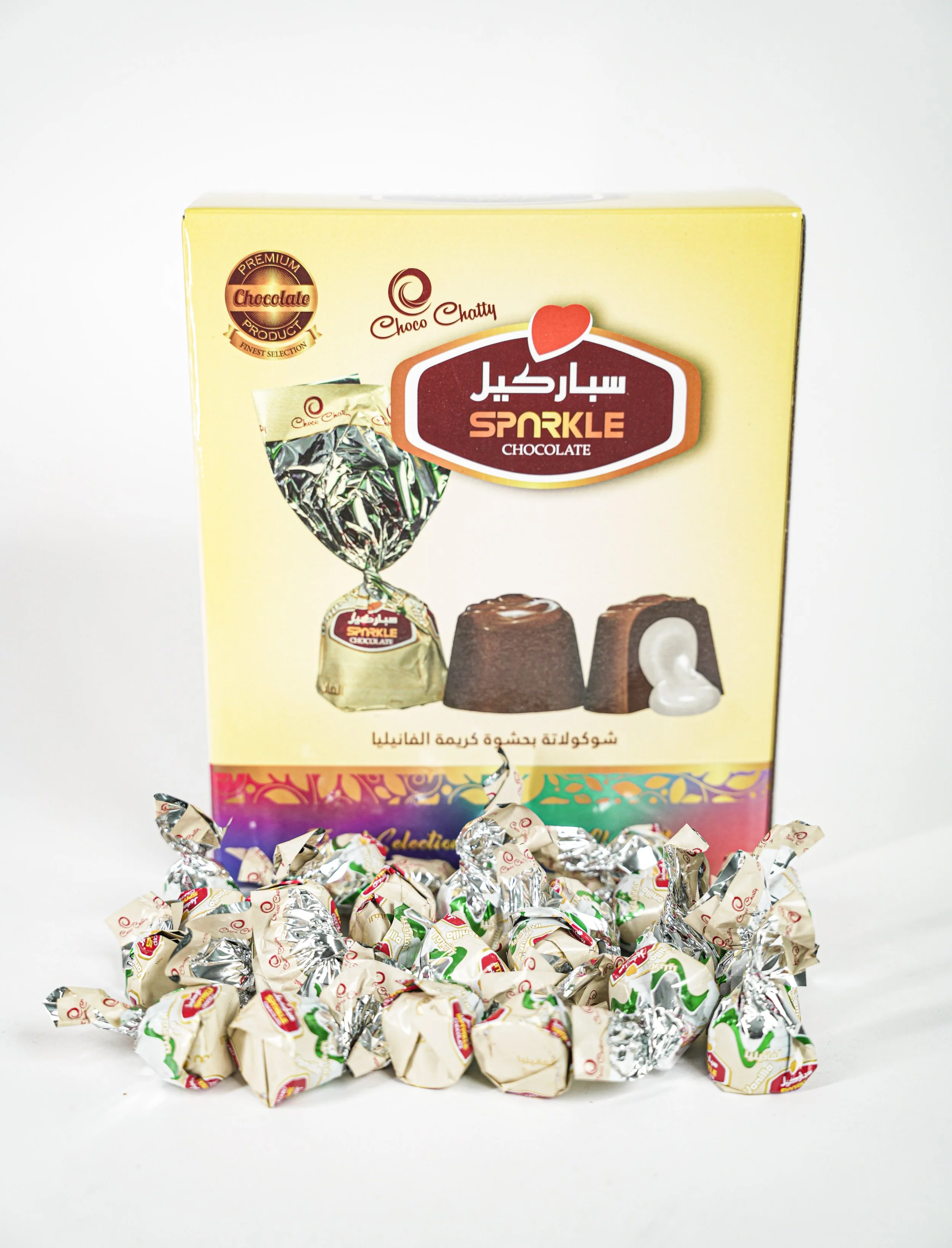 Box of Choco Chatty Sparkle chocolate candies with individually wrapped candies in front of the box.