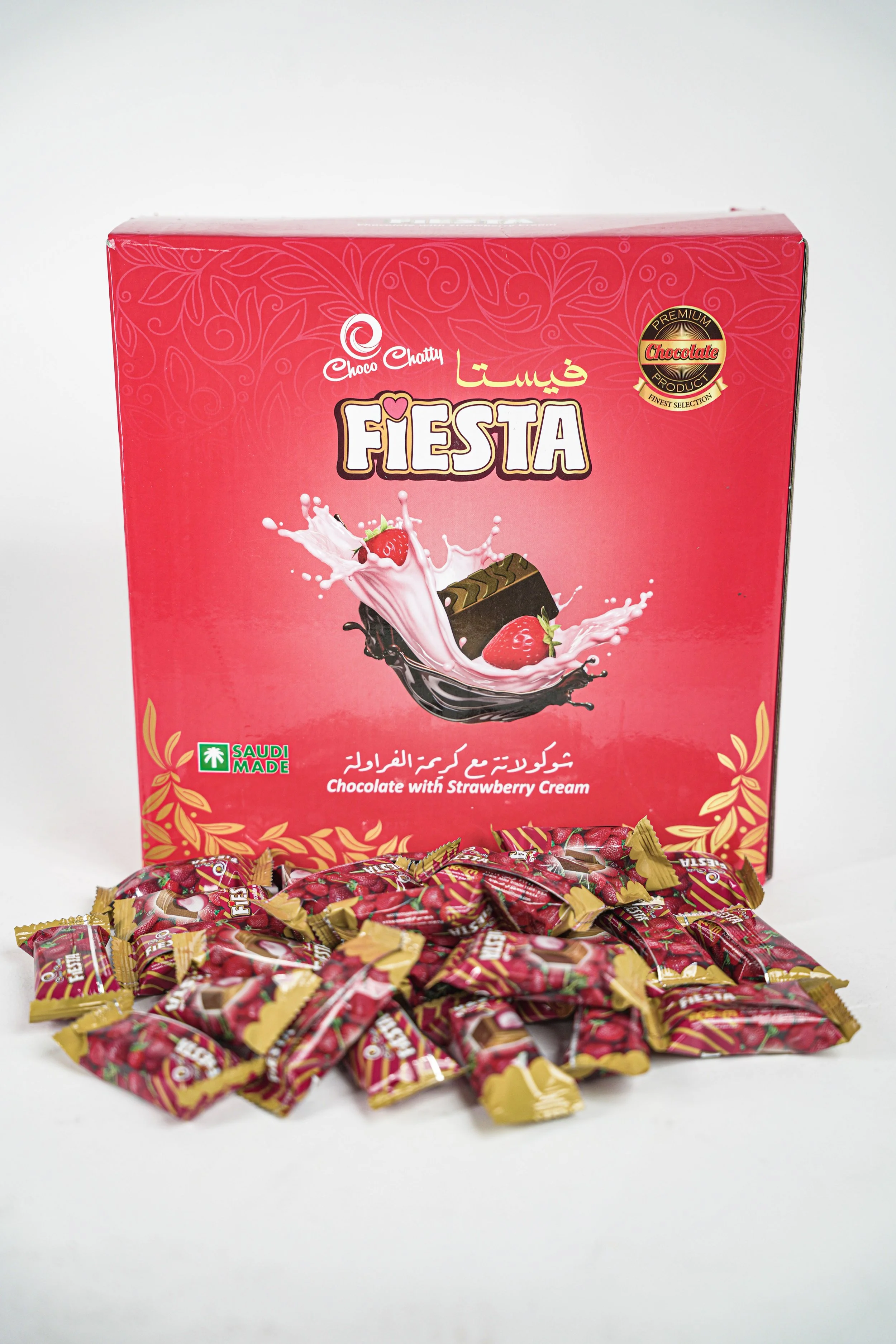 Box of Choco Chatty Fiesta chocolate with strawberry cream, with individually wrapped candies in front of the box.