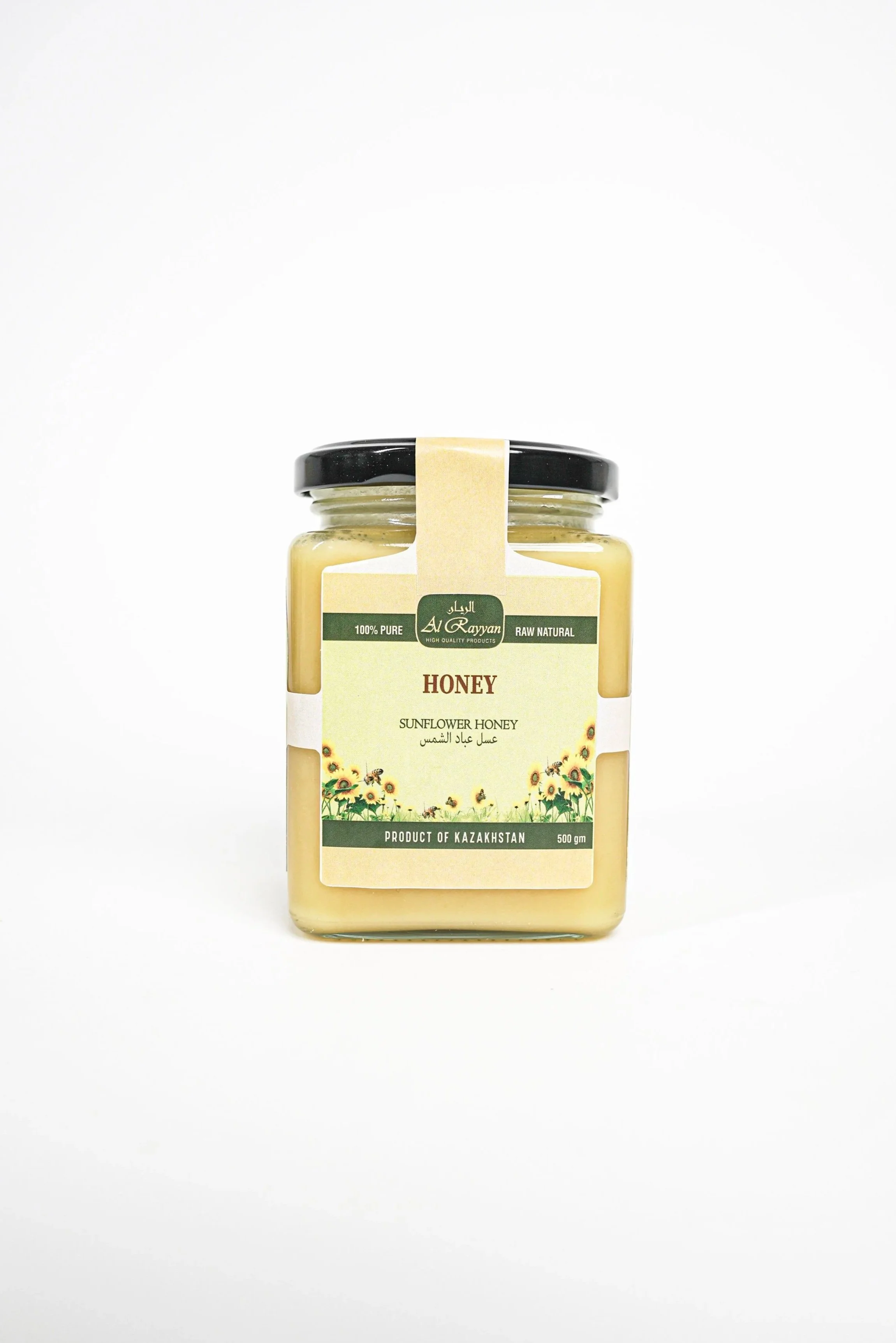 A jar of sunflower honey with a label indicating it is 100% pure, raw, natural, and produced in Kazakhstan, placed on a white background.