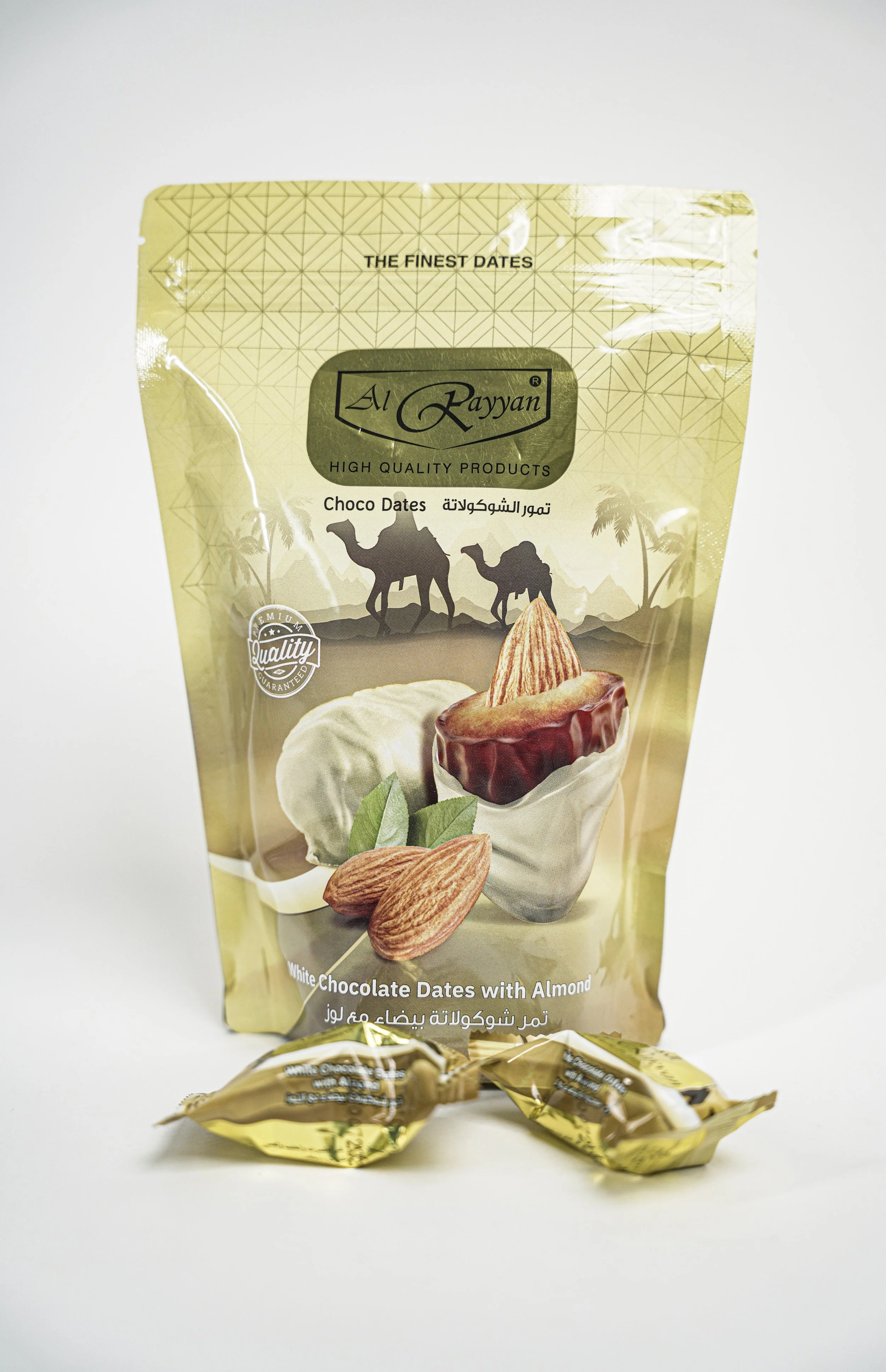 Package of Al Rayyan white chocolate dates with almonds, featuring images of chocolate dates and almonds on the front.