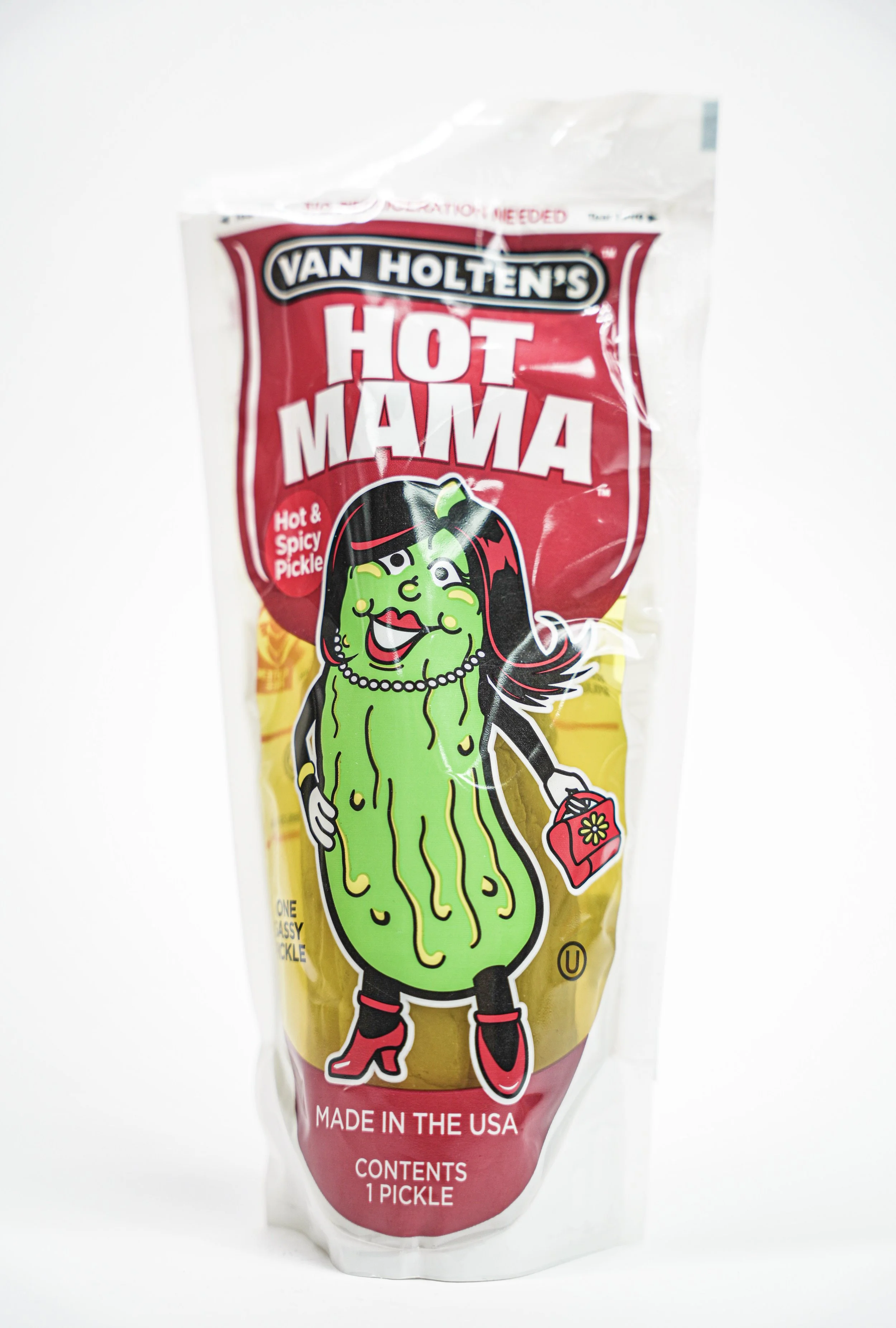A package of Van Holten's Hot Mama spicy pickle featuring a cartoon pickle dressed as a woman, with makeup, high heels, a dress, and holding a handbag.