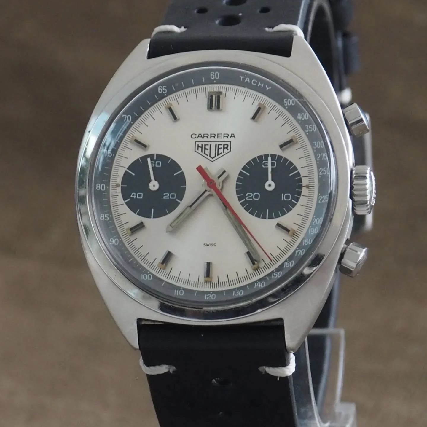 Vintage Heuer Carrera Chronograph Valjoux 7733 Panda Dial Manual Wind
A superb vintage Heuer Carrera chronograph powered by the legendary Valjoux 7733 manual wind movement, presented in exceptional condition.

Clean silver dial, contrasting black reg