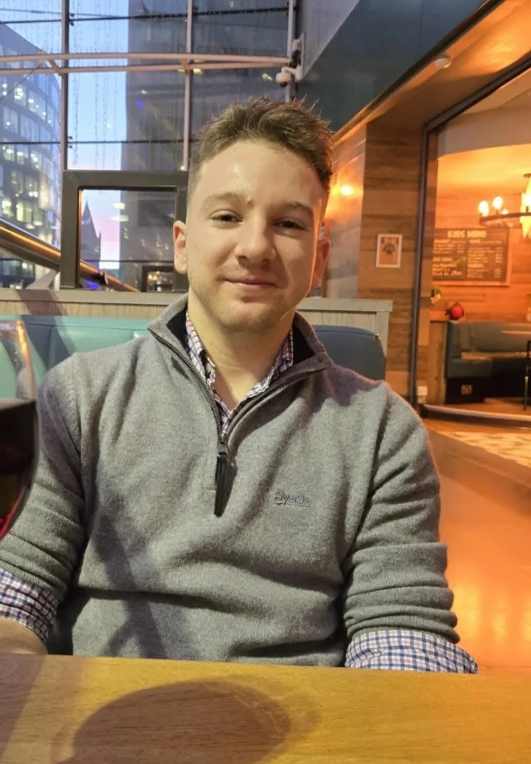 A white spherical object casting a shadow on a light gray background.