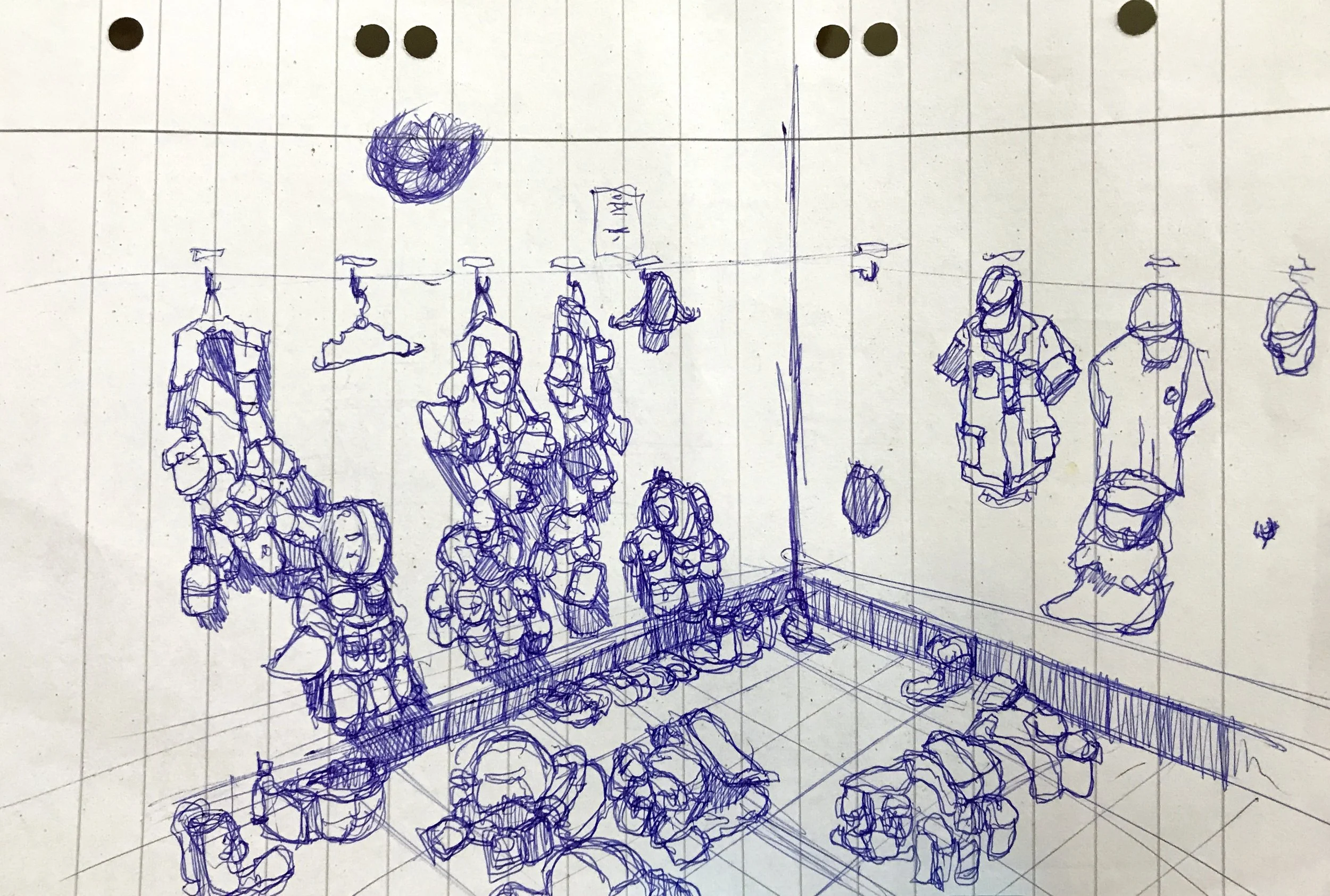 Sketch of a store display with hanging bags, on a grid-lined background.