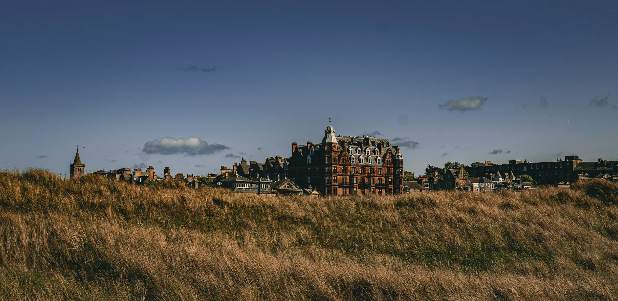 St Andrews coastline with historic hotel and golf links, Fife, Scotland