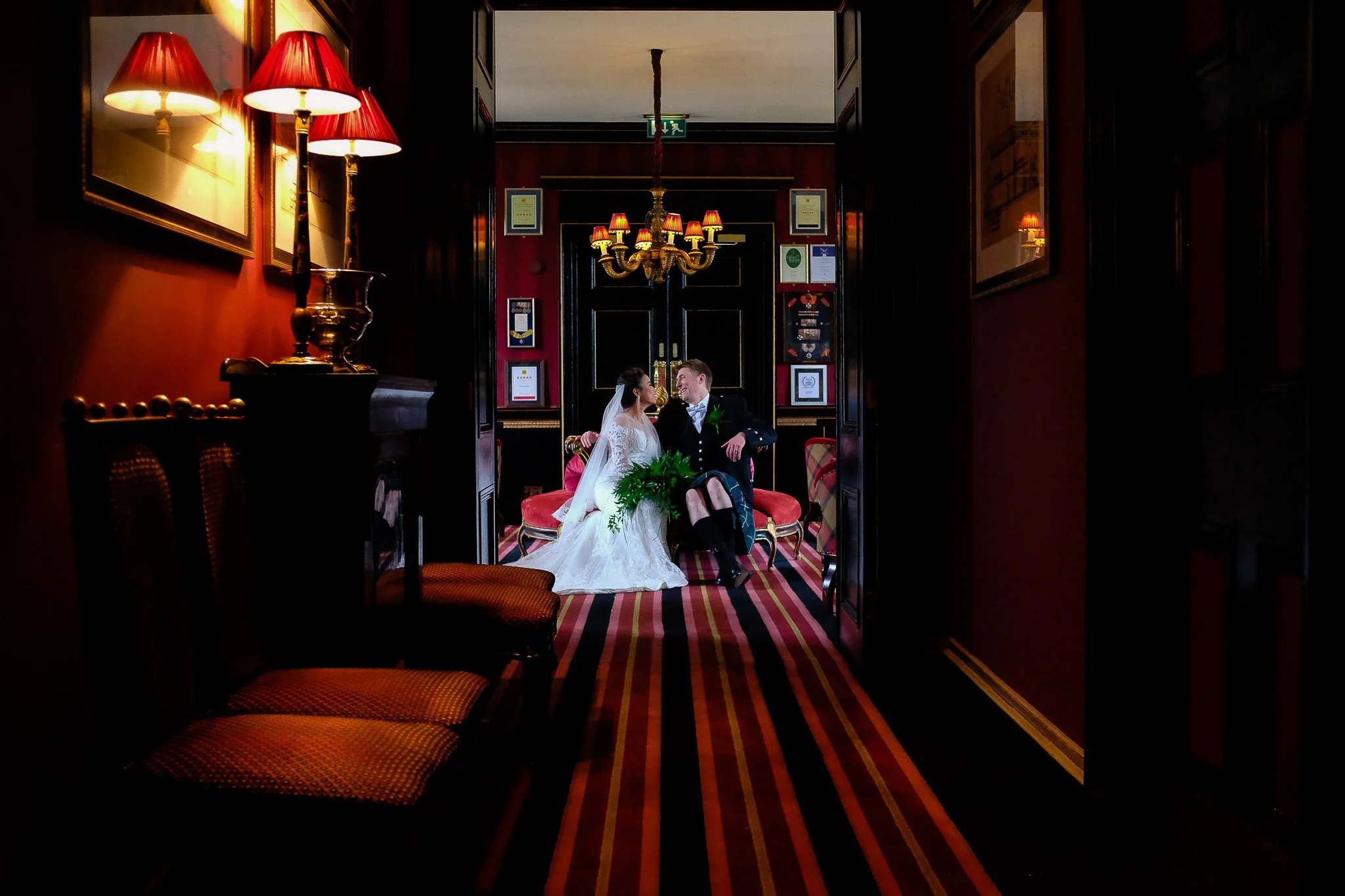 Bride and groom in kilt at Prestonfield House, Edinburgh, Scotland