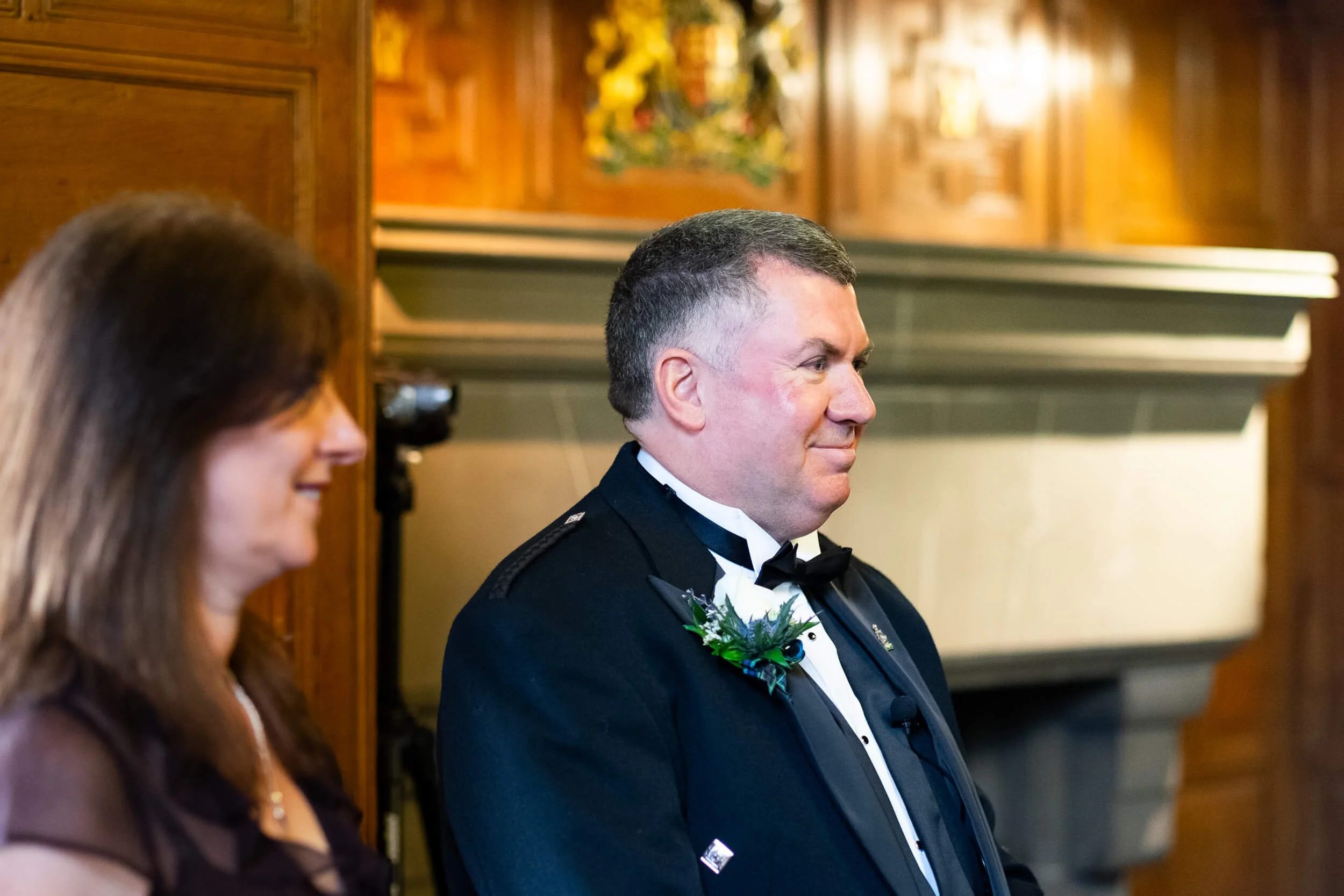 Groom in Scottish kilt waiting for the bride at Edinburgh Castle wedding ceremony — documentary wedding photography