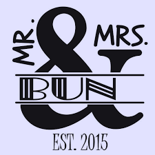 Assorted cookies and cupcakes with frosting on a black tray, with the text 'Mr & Mrs' and a heart logo.