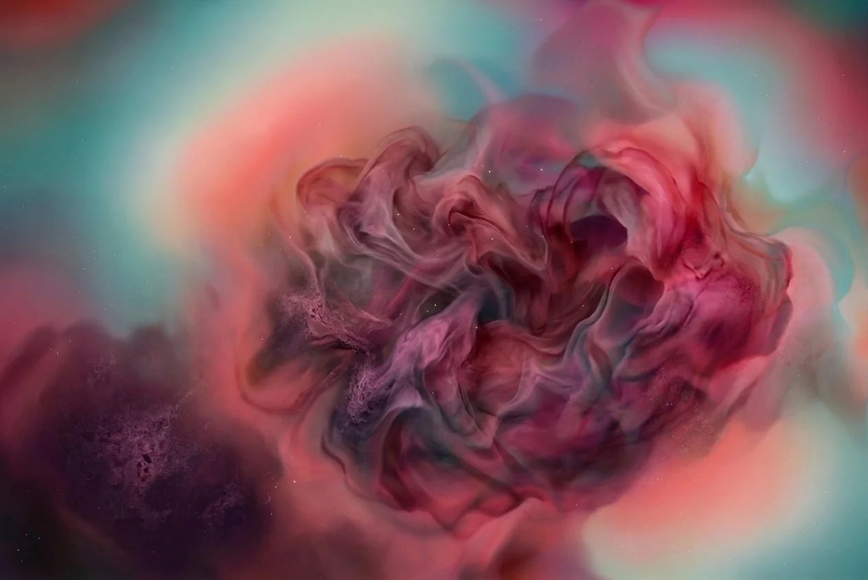 Abstract image with swirling colors of pink, purple, and green, resembling a flower or organic shape.