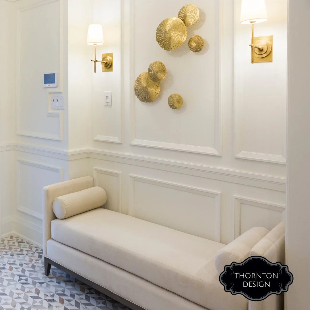 The custom details are what guests remember.

A bench cushion in your favourite colour at the entry. A pair of lamps in the foyer that says welcome before you do. Drapery that softens the dining room. A console styled with seasonal art and one fragra