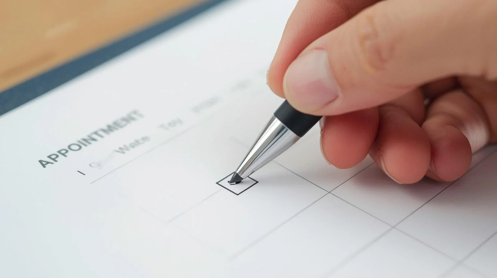 Close-up of hand checking off a box on a form titled "APPOINTMENTS".