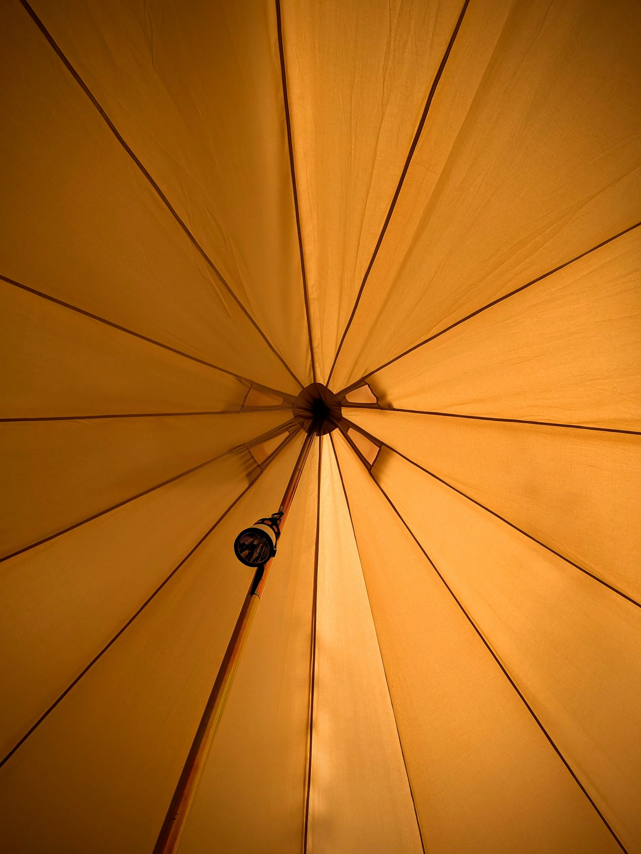 Looking up at the center of a glamping bell tent.