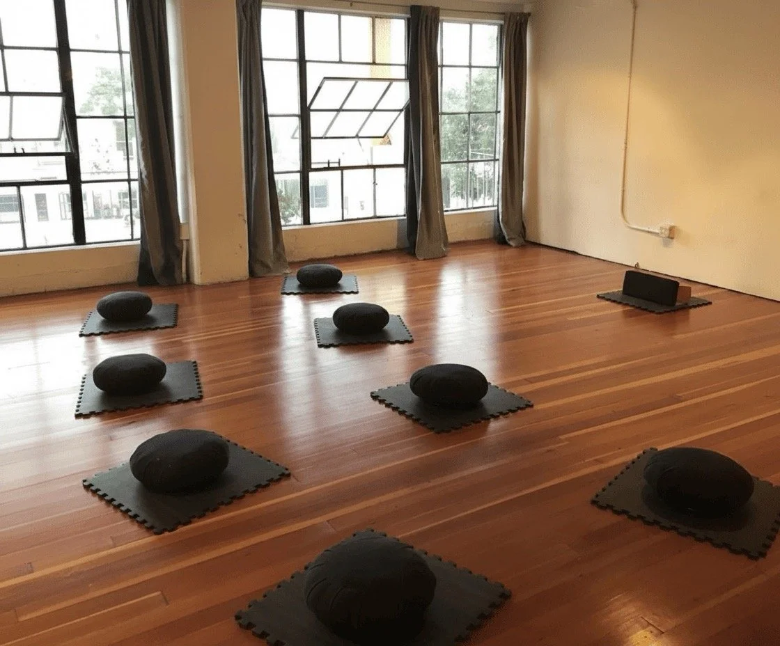 Menditation cushions before a mindfulness class | chairs are also available
