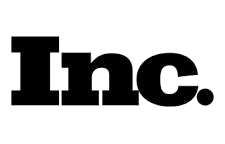 The black logo of the text 'Tnc' with a small black dot over the letter 'n'.