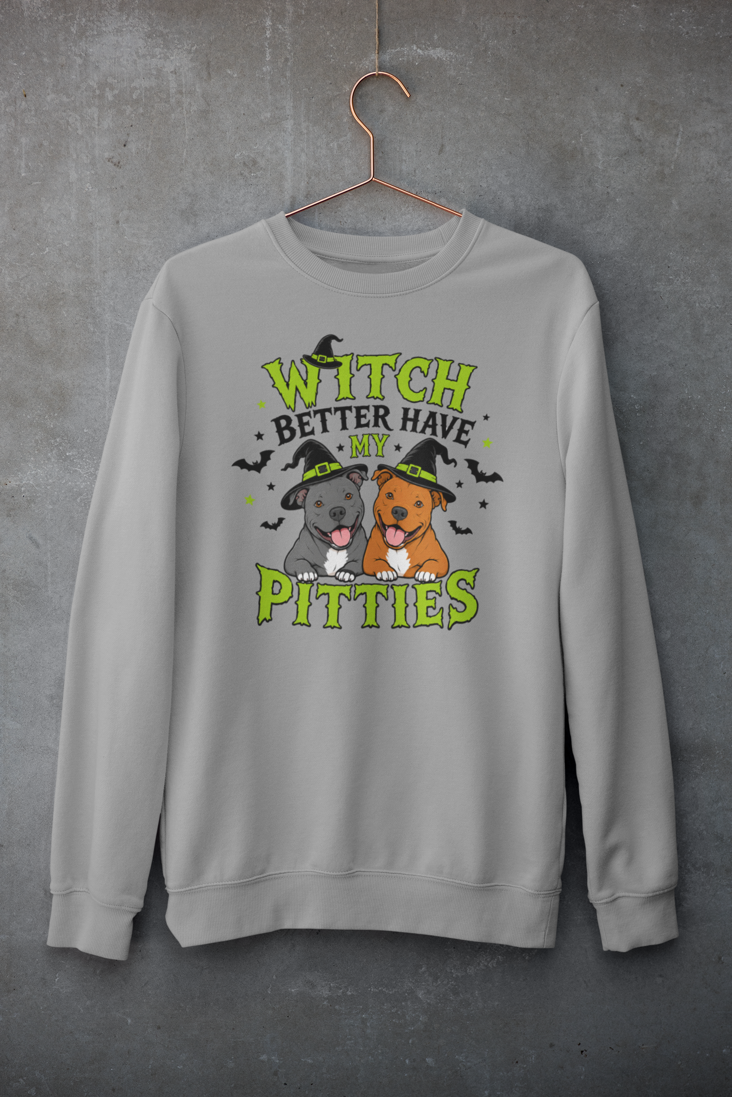 Gray Halloween crewneck featuring two smiling pit bulls wearing witch hats with green and black typography reading “Witch Better Have My Pitties,” surrounded by bats and stars.