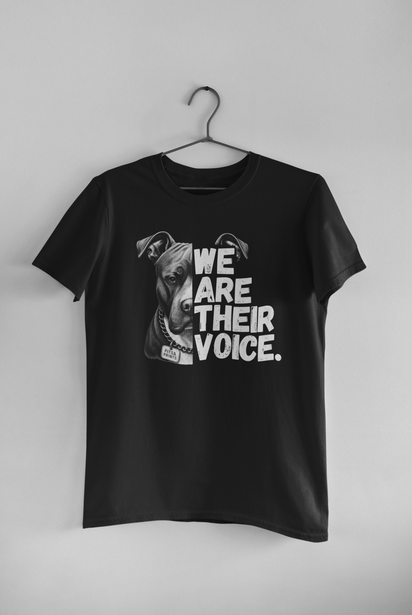 Black We Are Their Voice pit bull advocacy t-shirt featuring a black-and-white pit bull portrait and bold white typography by Pits & Prints.