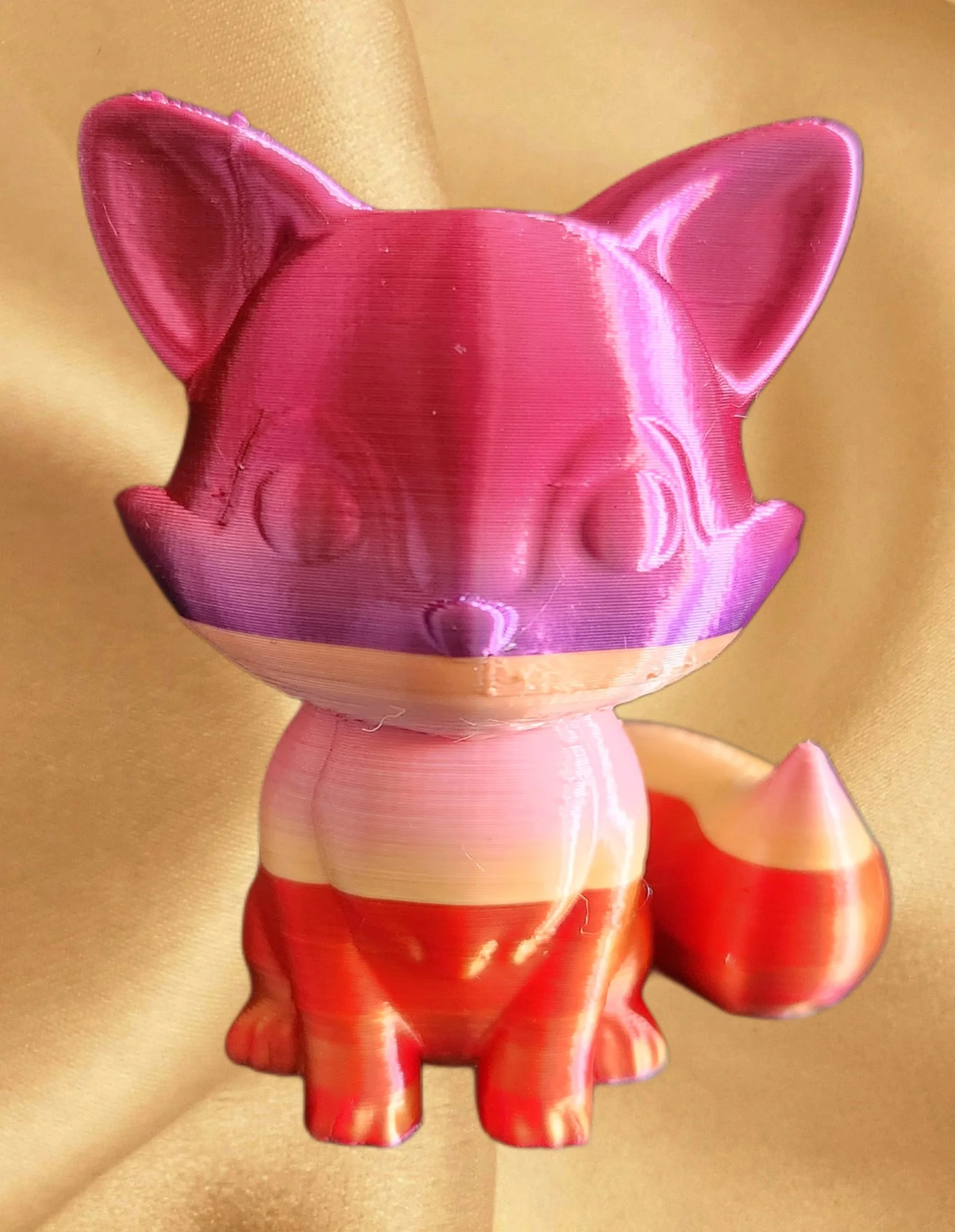 A person wearing gold stockings and red high heels, holding a shiny pink, pig-shaped container.