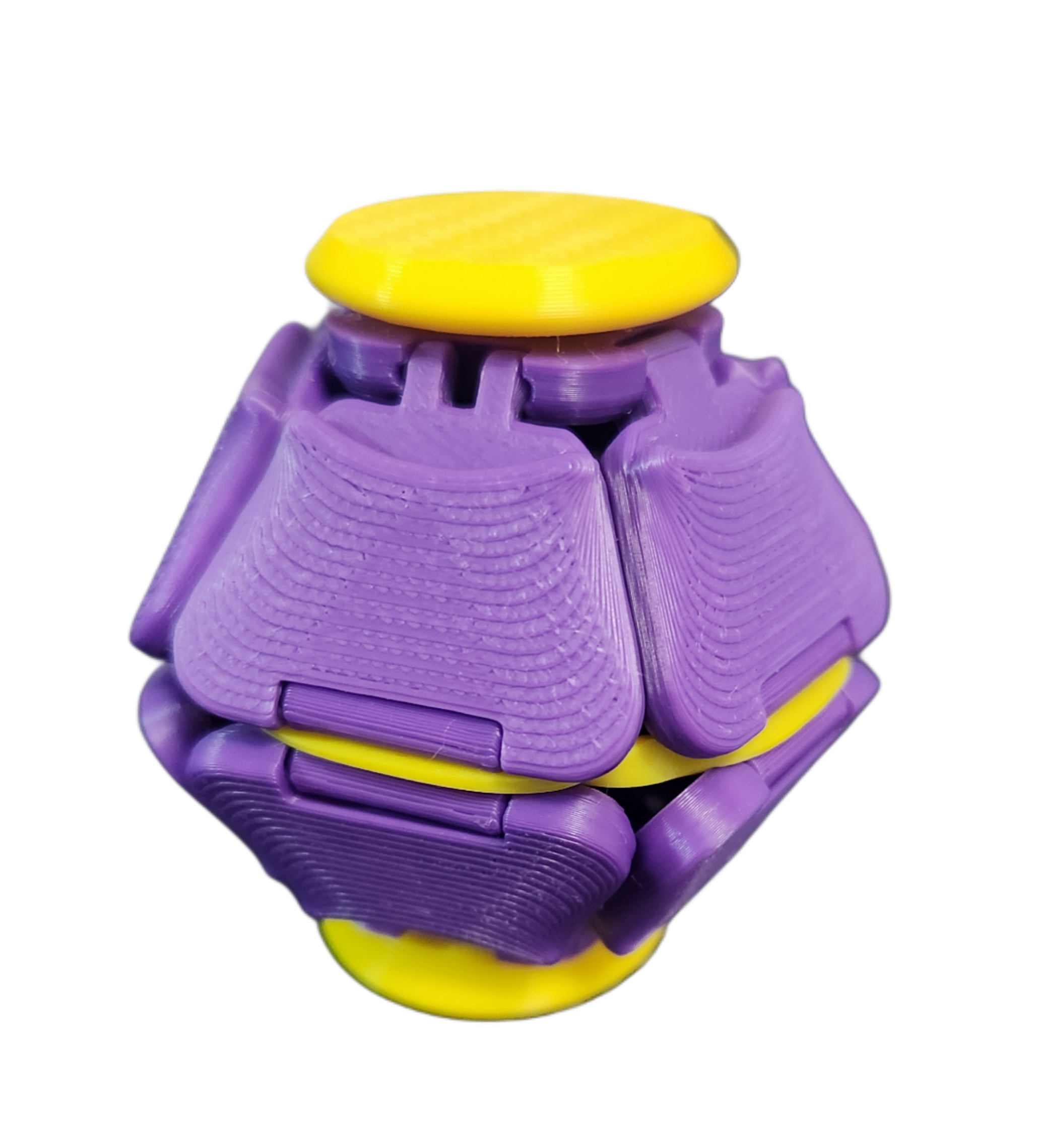 Colorful toy insect with purple body, yellow accents, and a yellow oval head, set against a black background.