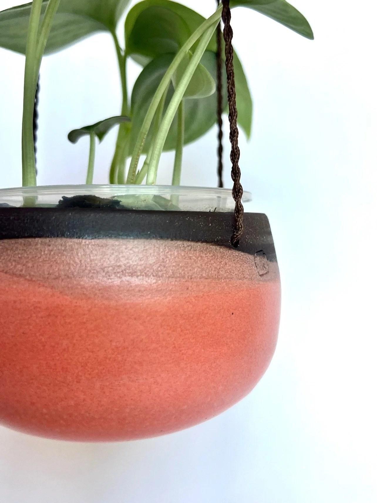 This glaze is called Melon Head, and while I didn't name it, I did figure out what it does when you dip dark chocolate into it.  Alternating angles, creating overlapping horizons, terracotta stacking on salmon stacking on almost black clay.  Geologic