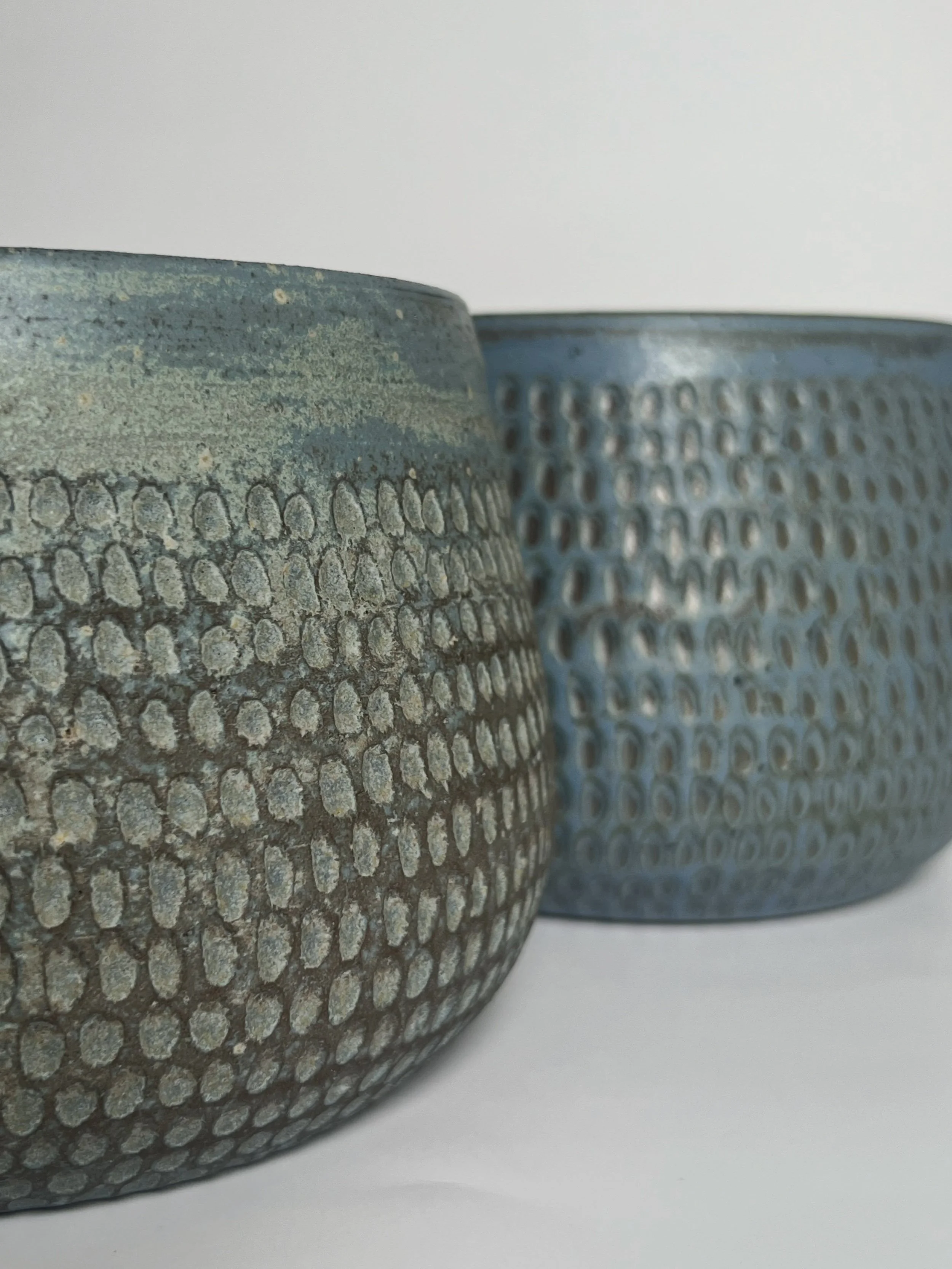 I&rsquo;ve been in full experiment mode in the studio lately &mdash; new glazes, new clay bodies, and new felt plants!

This pair is a result of all that experimentation - same glaze but two completely different clay bodies underneath. One is my trie