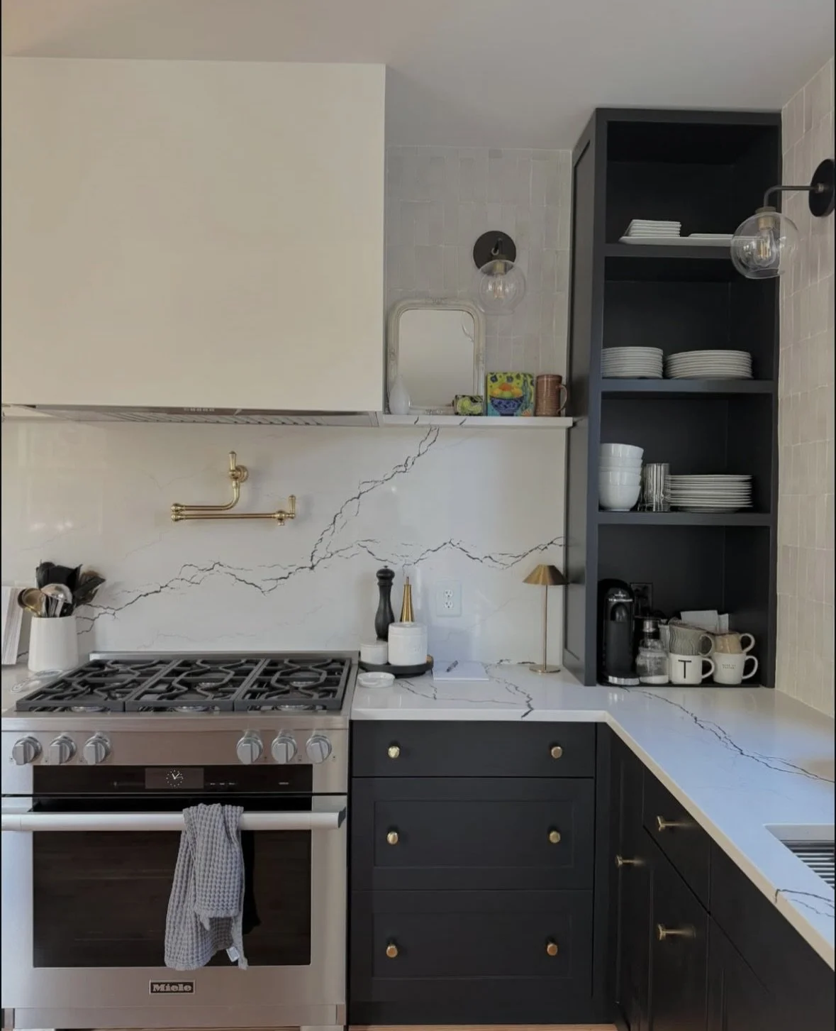 Kitchen with dark painted cabinets