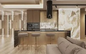 Modern kitchen with wooden cabinets, black countertops, bar stools, and marble accent walls.