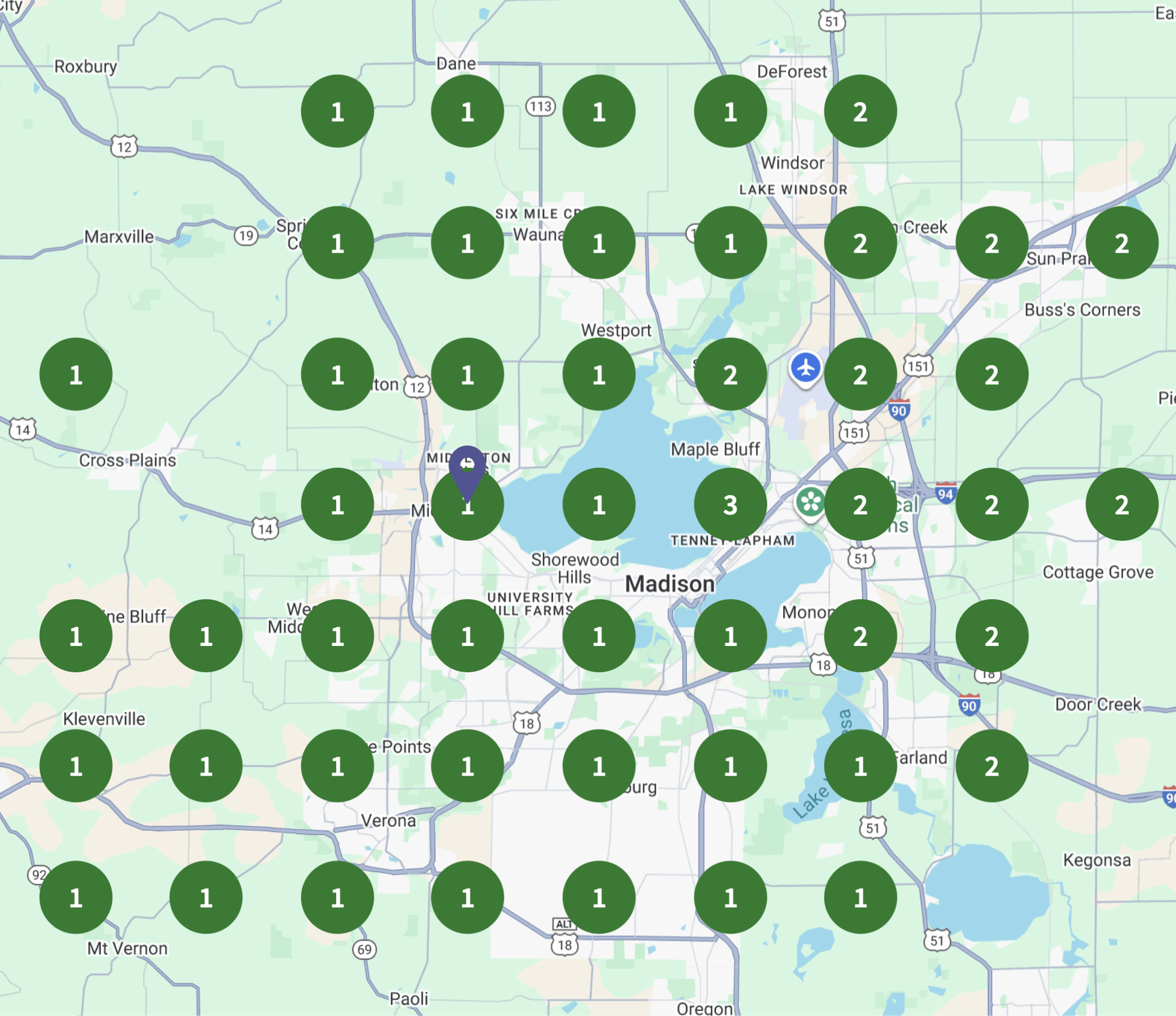 Map of Madison, Wisconsin, showing multiple green circles with numbers indicating location points, as well as an aircraft icon and a purple location pin in the city center.