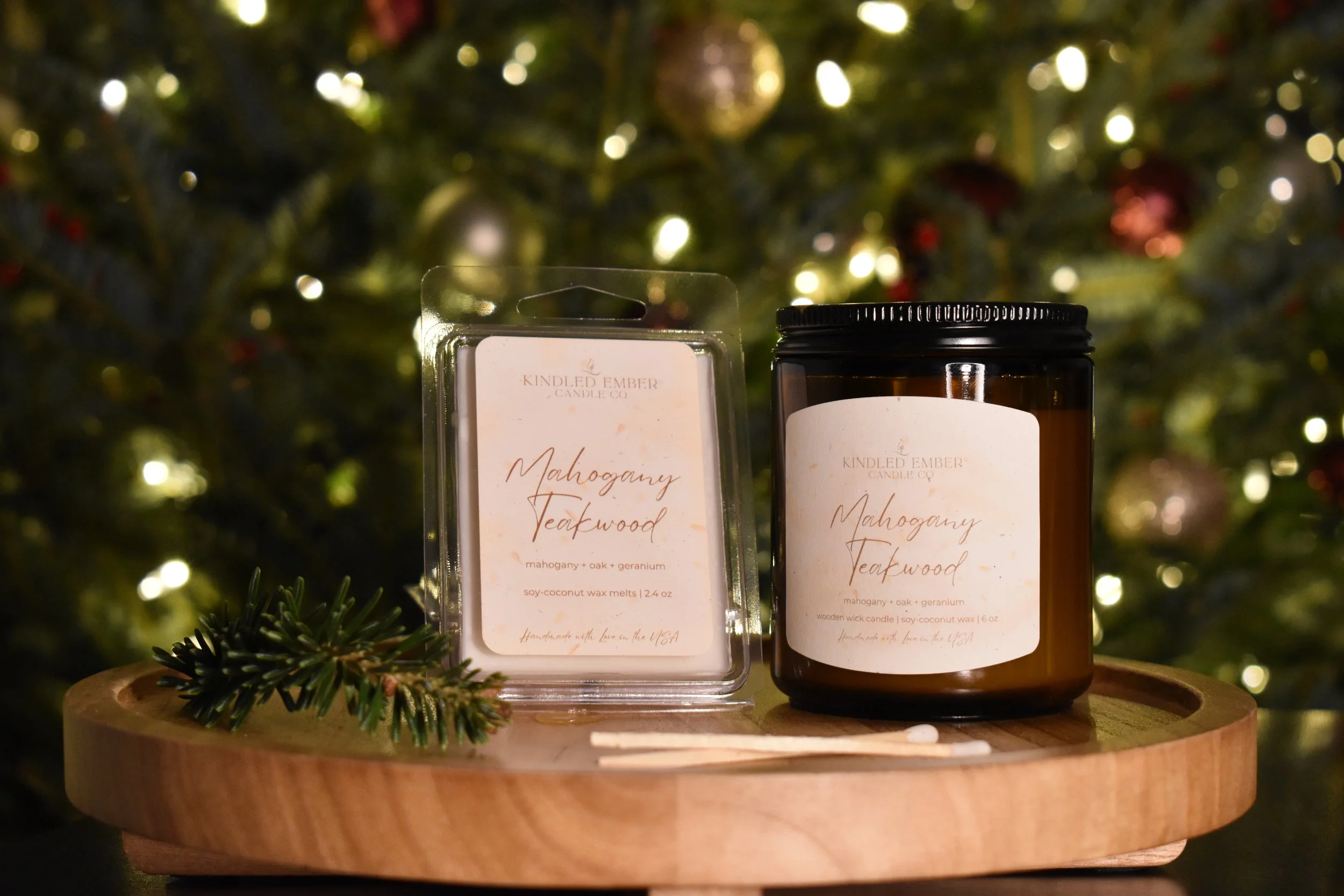 Mahogany Teakwood Wax Melt and Candle in front of Christmas tree