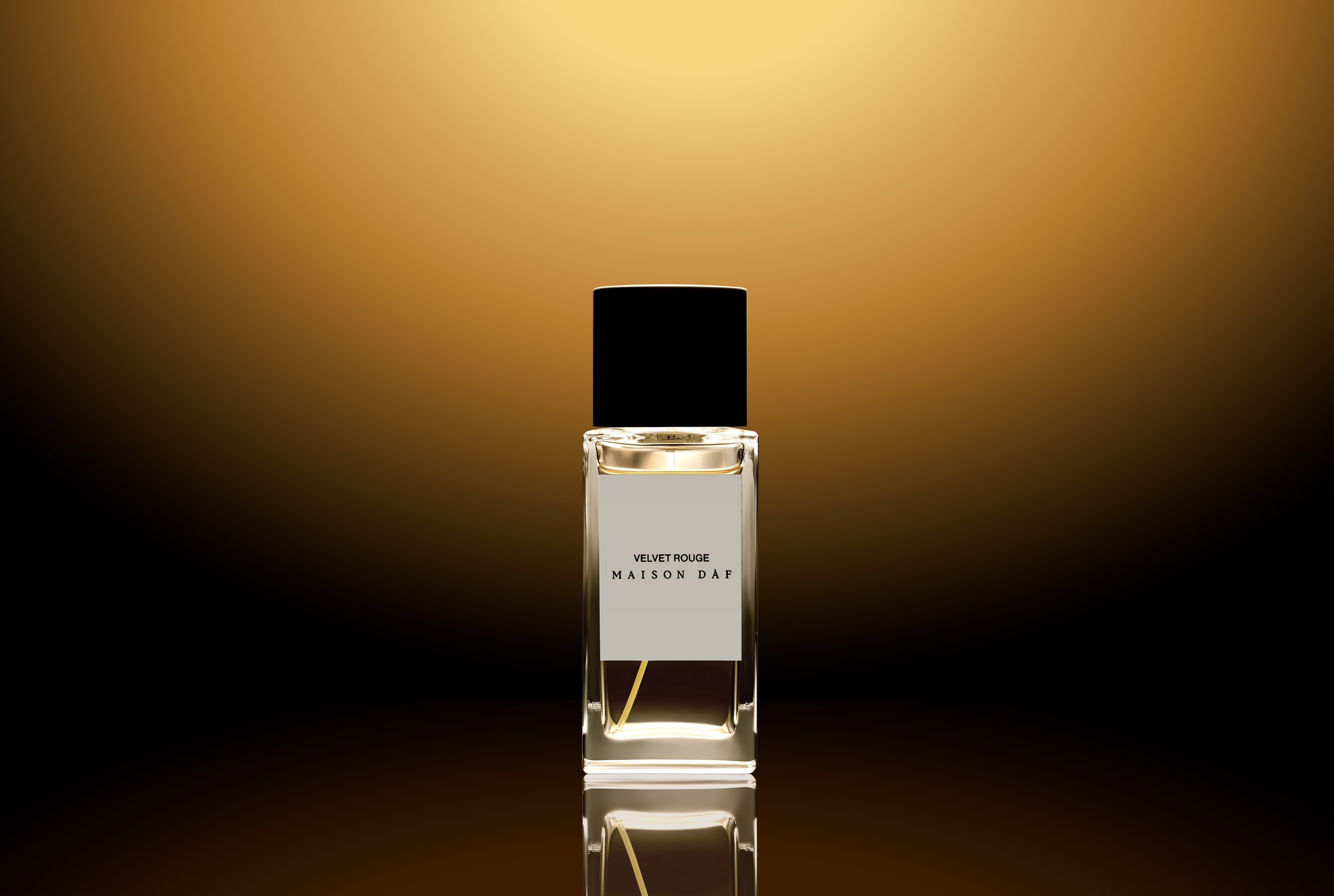 A clear glass perfume bottle with a black cap, labeled 'Velvet Rouge Maison D e2f,' set against a gradient golden-brown background.