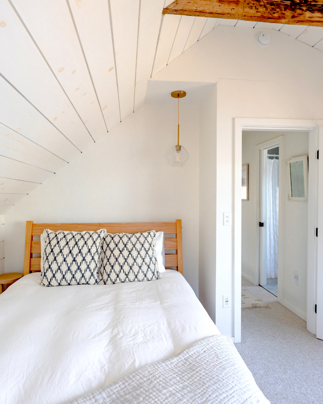 Guest-ready vacation rental bedroom with fresh white linens and hotel-quality presentation.