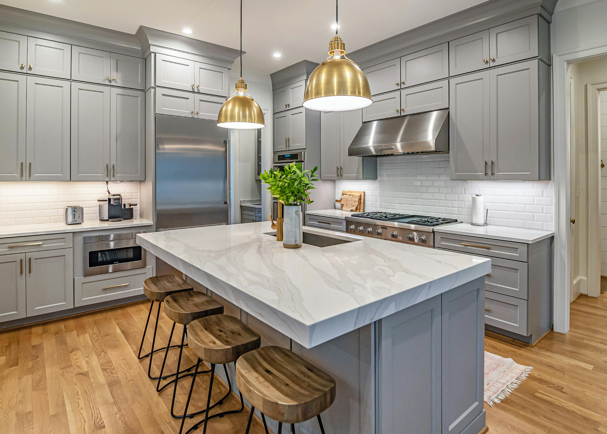 Clean and organized modern kitchen prepared as part of a vacation rental turnover cleaning service.