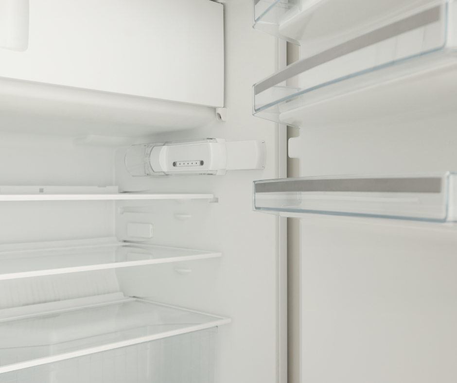 Spotless refrigerator interior cleaned as part of deep cleaning and vacation rental turnover service.