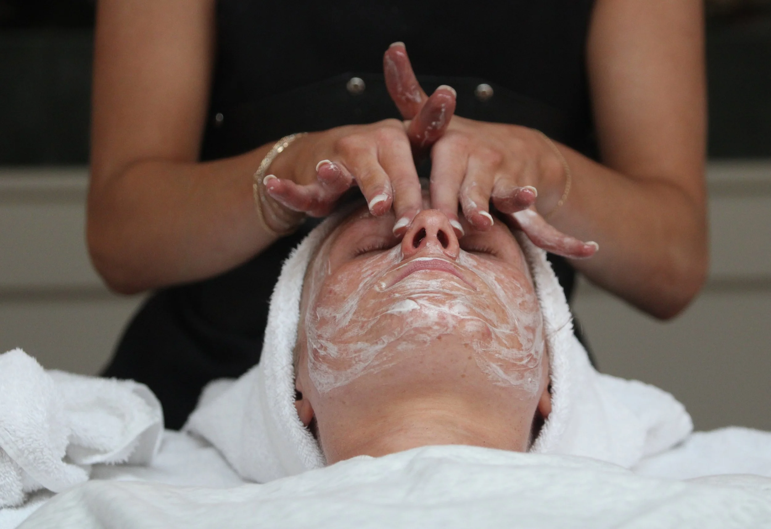 Customer Marley Walter receives a “Glow + Go” Skinhouse signature facial done by Skintender Mady Dibias.
