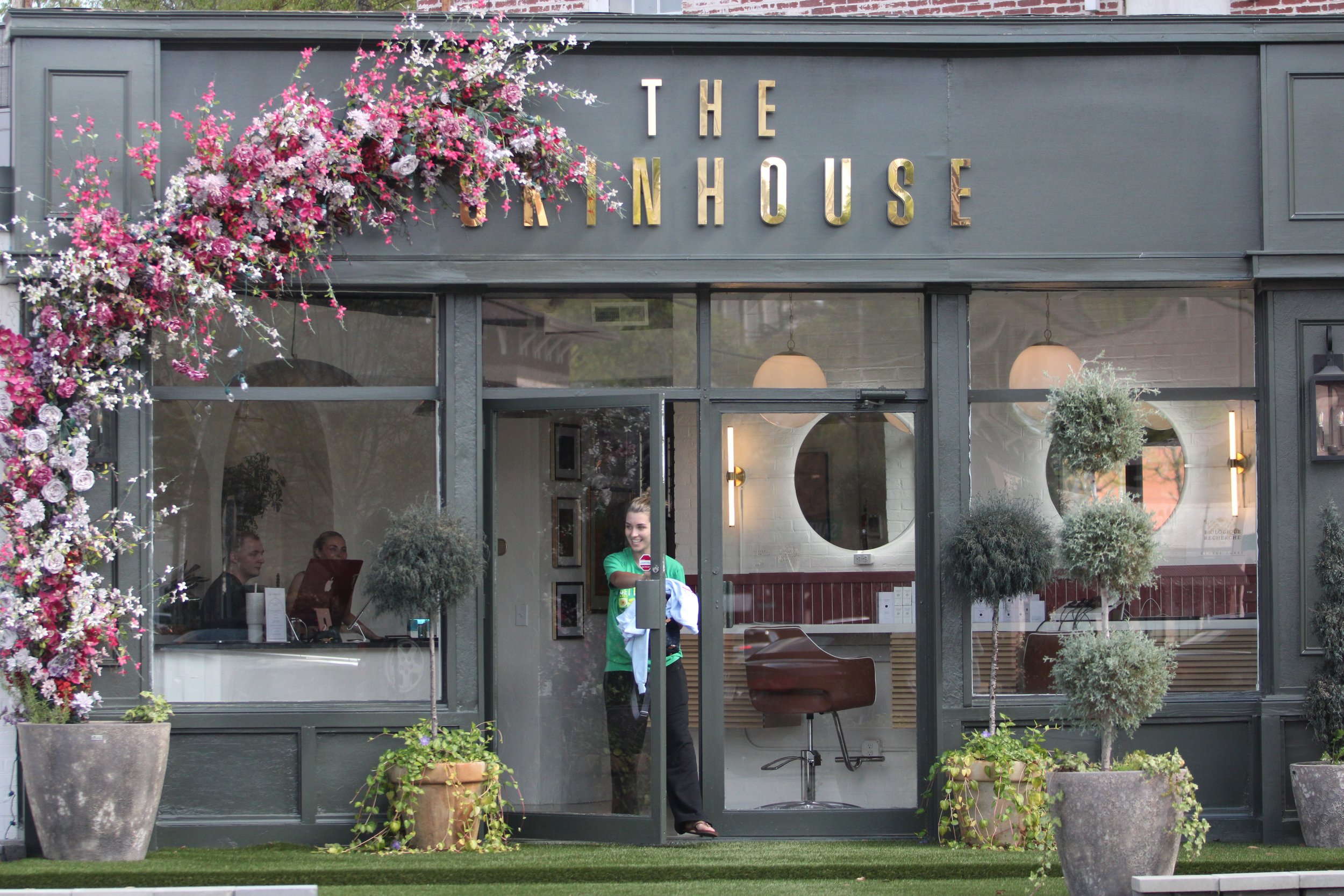 Customer Arden Neighbors walks out of the Skinhouse after she finishes up with her spray tan appointment.