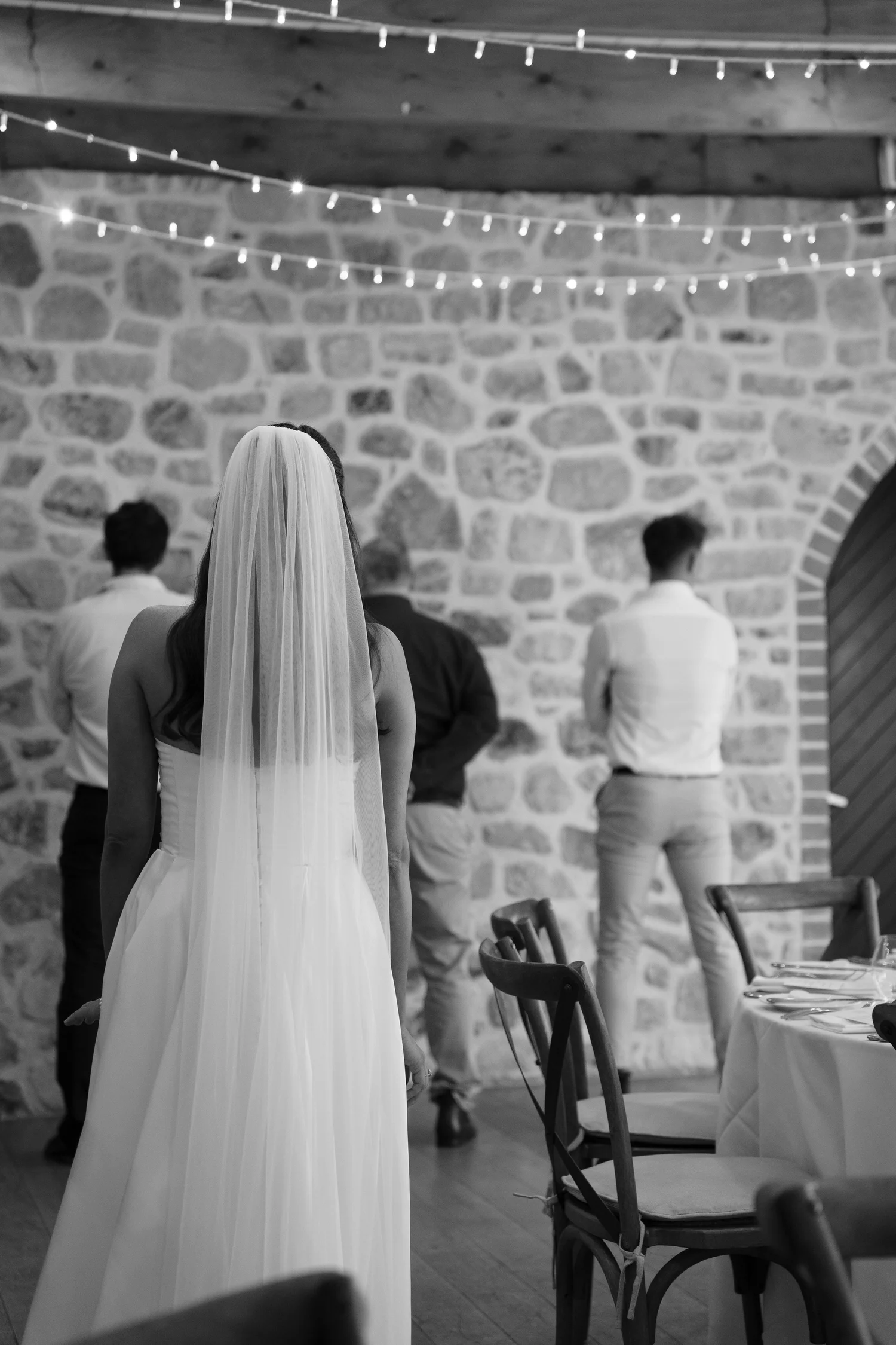 Couple beside an old stone wall