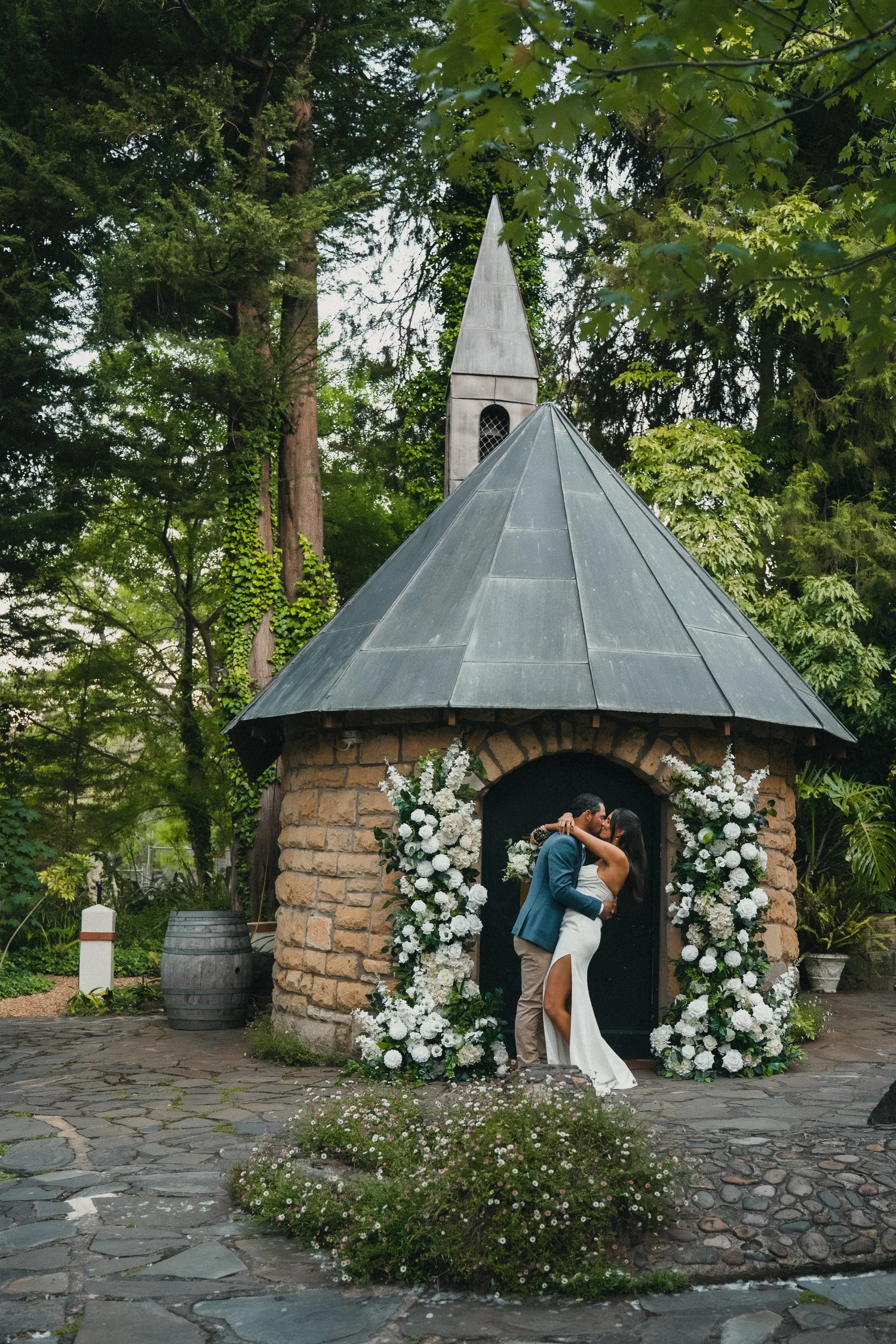 Couple kissing in a chapel doorway